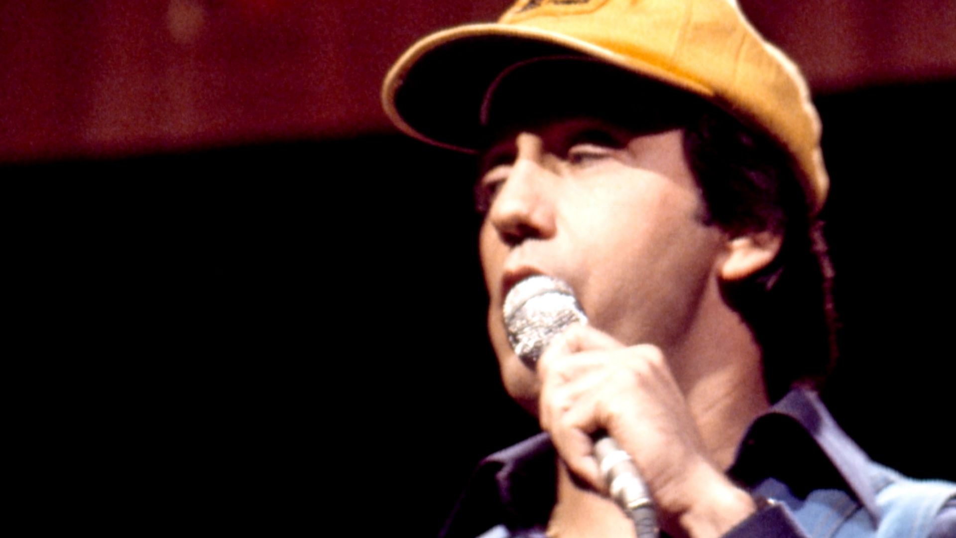 Ray Stevens performing in concert: photo taken during the taping of The Johnny Cash Show in Nashville in the 1970s; Ray Stevens is wearing a