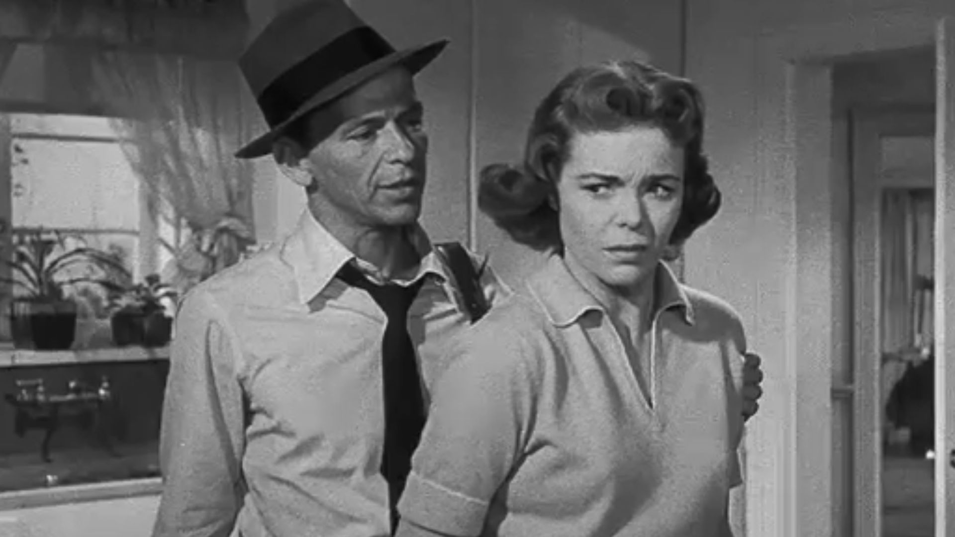 Frank Sinatra and Nancy Gates in a photo frame of Suddenly.