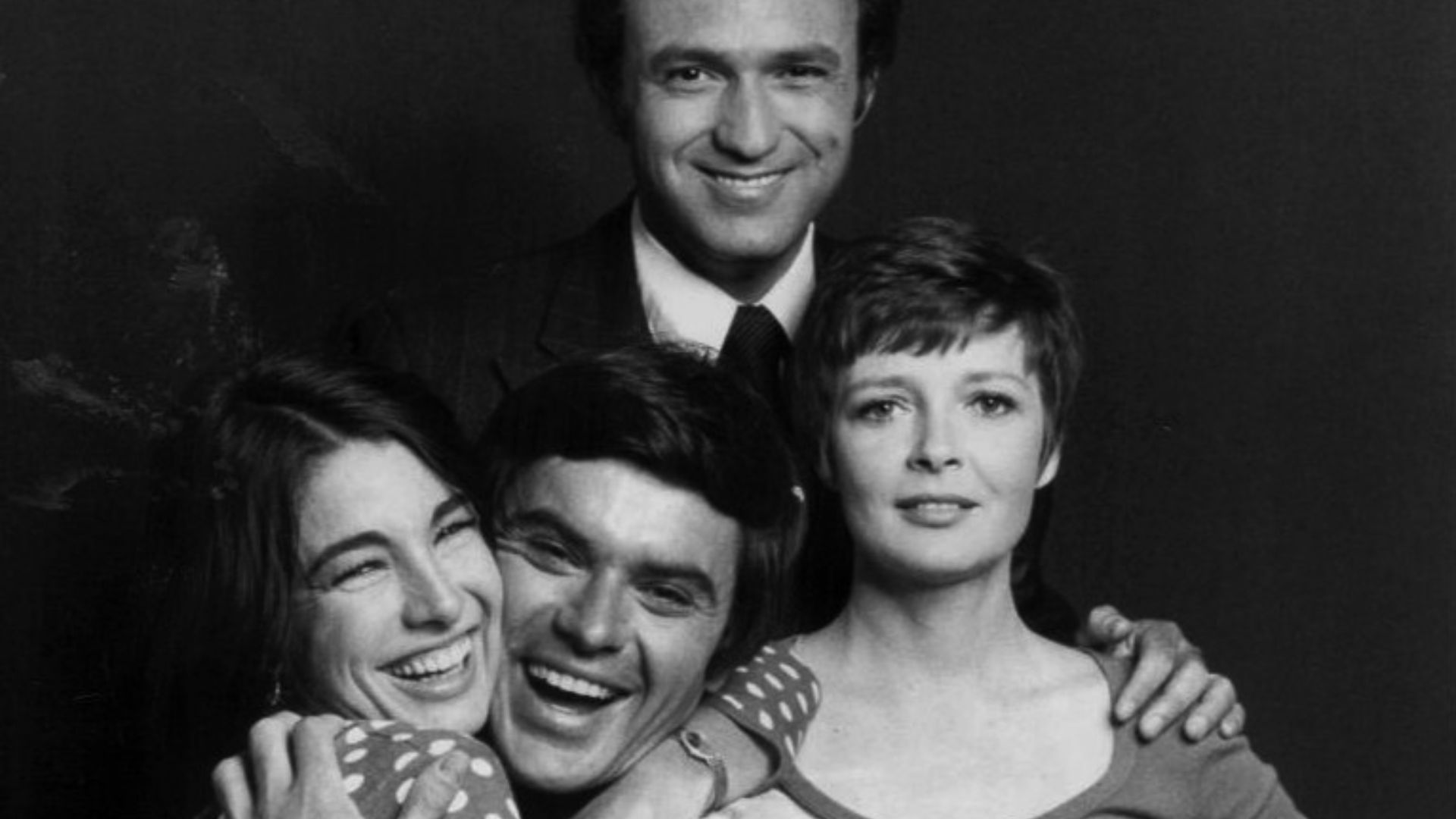 Cast photo from the television comedy Bob & Carol & Ted & Alice.  From left-Anne Archer, Robert Urich, David Spielberg, Anita Gillette.