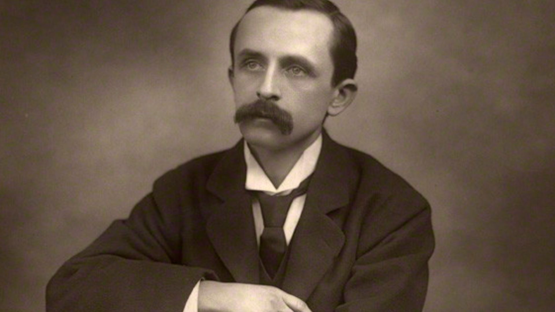 Sepia carbon print of James Matthew Barrie (1860-1937), author of