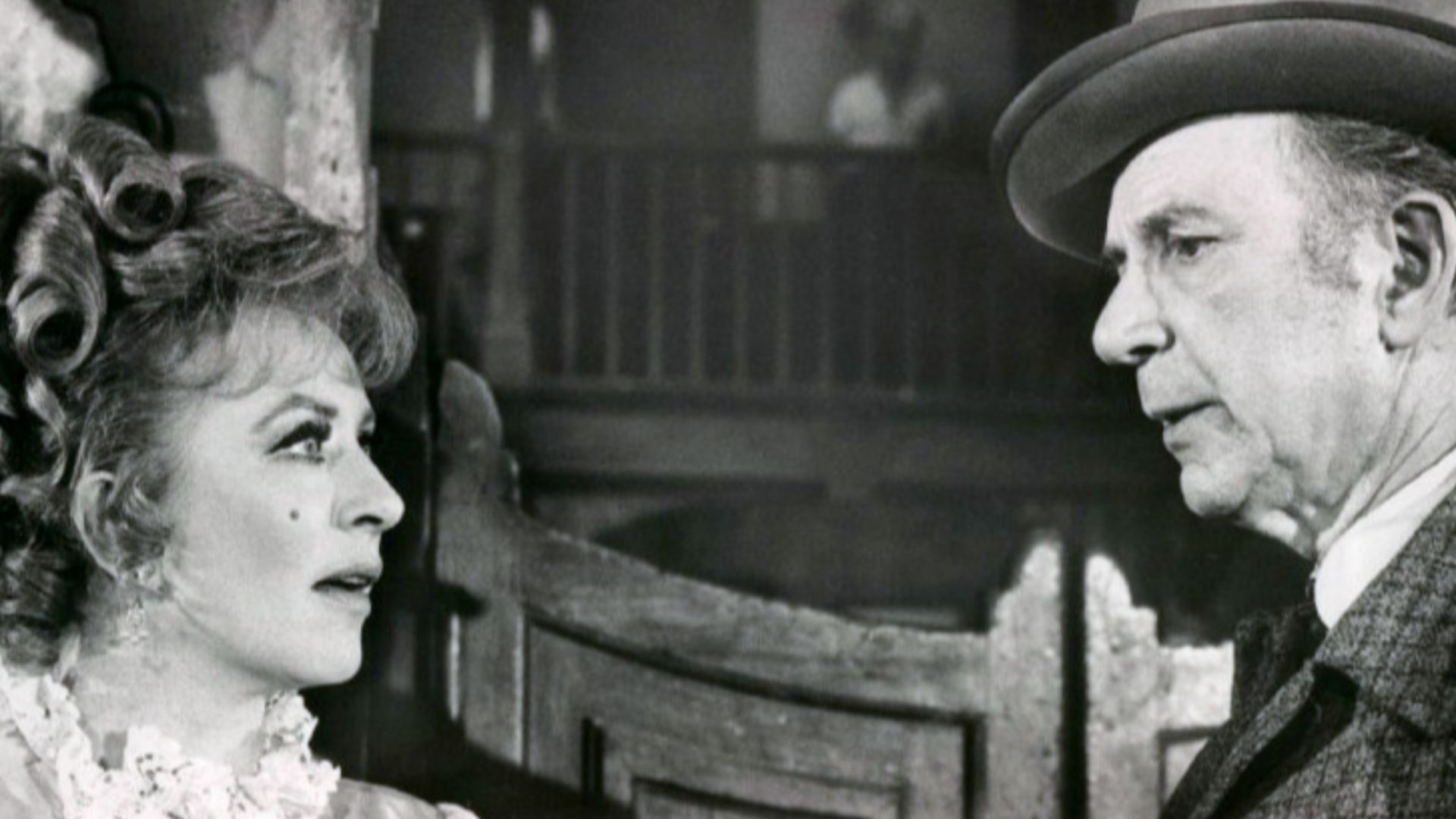 Photo of Amanda Blake as Kitty Russell and guest star Jack Albertson from the television program Gunsmoke.