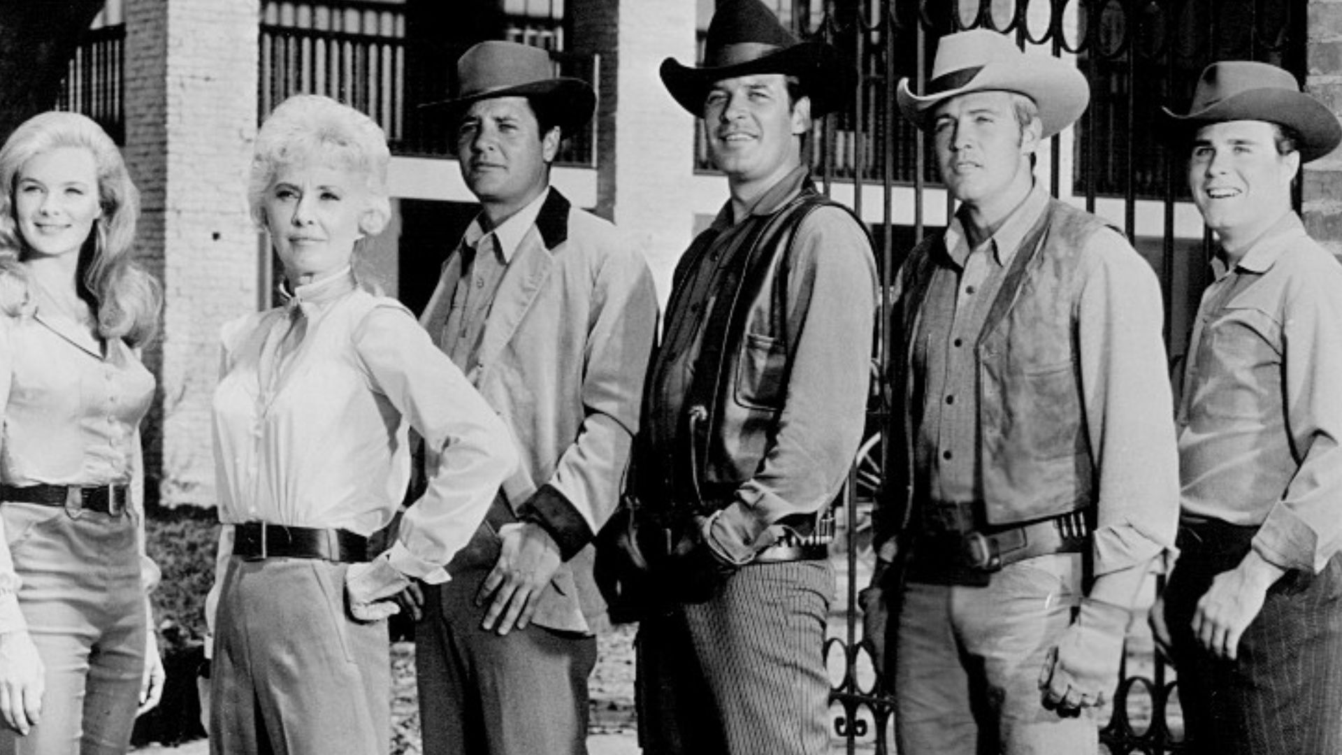 Photo of the cast of the television Western The Big Valley. From left: Linda Evans (Audra), Barbara Stanwyck (Victoria), Richard Long (Jarrod), Peter Breck (Nick), Lee Majors (Heath) and Charles Briles (Eugene).