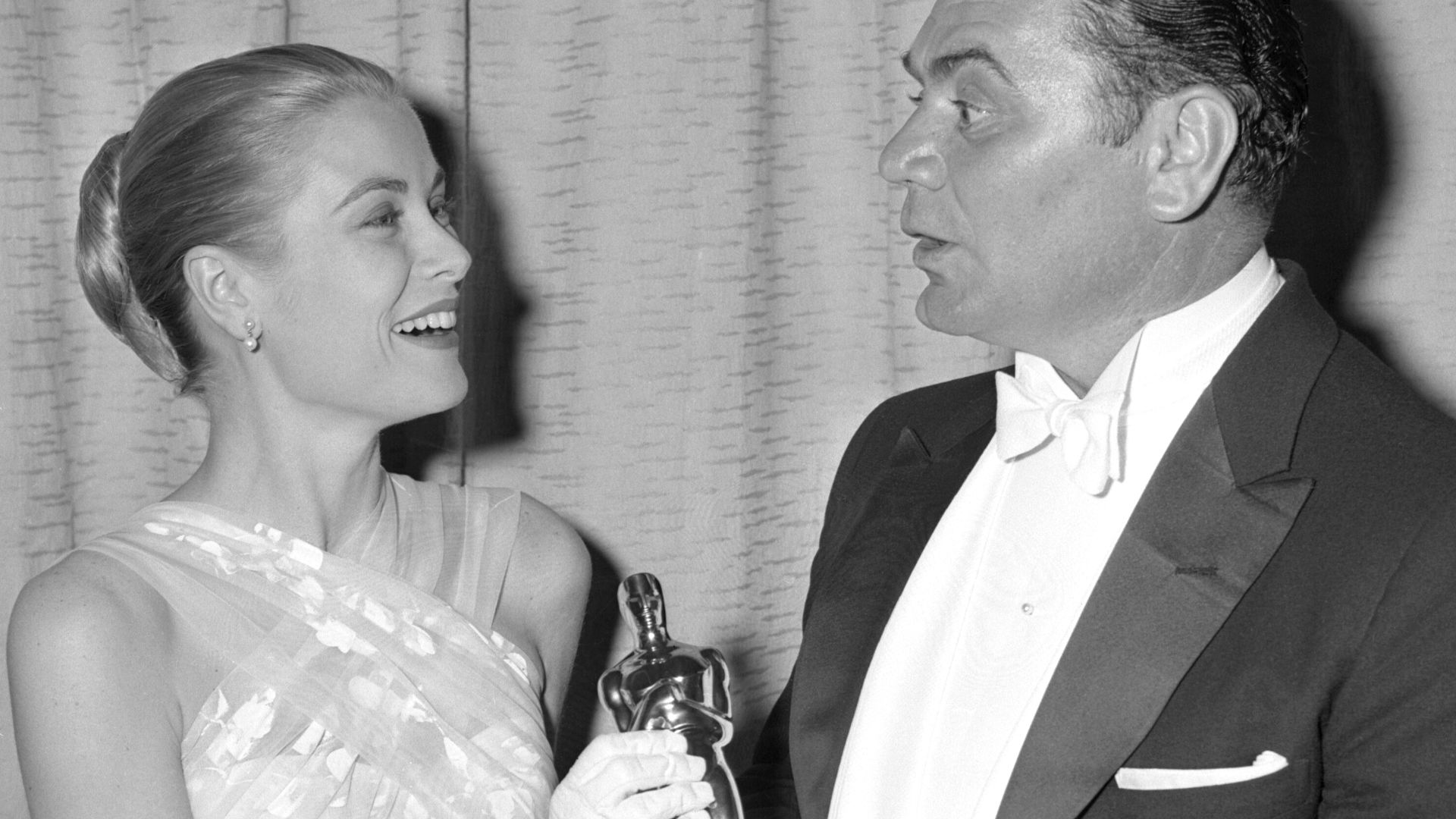 Grace Kelly presenting Ernest Borgnine the Oscar for best actor at the 28th Academy Awards held at the Pantages Theatre in Los Angeles. Borgnine won the award for his role in the film