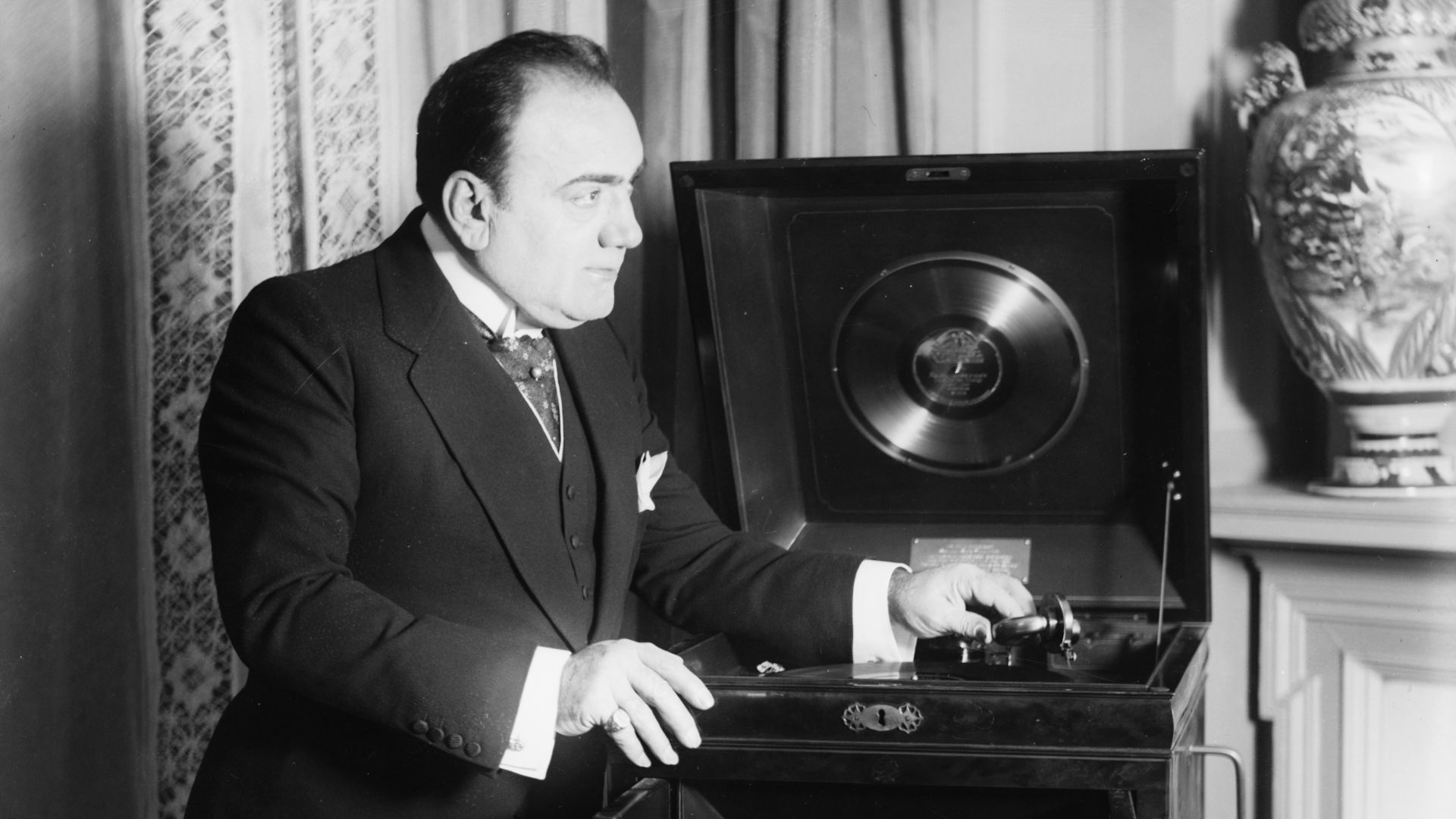 Enrico Caruso with phonograph. Glass negative.
