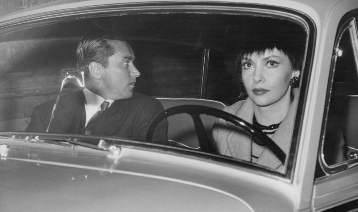 Italian actress Gina Lollobrigida returns home from a nightclub with her husband Milko Skofic