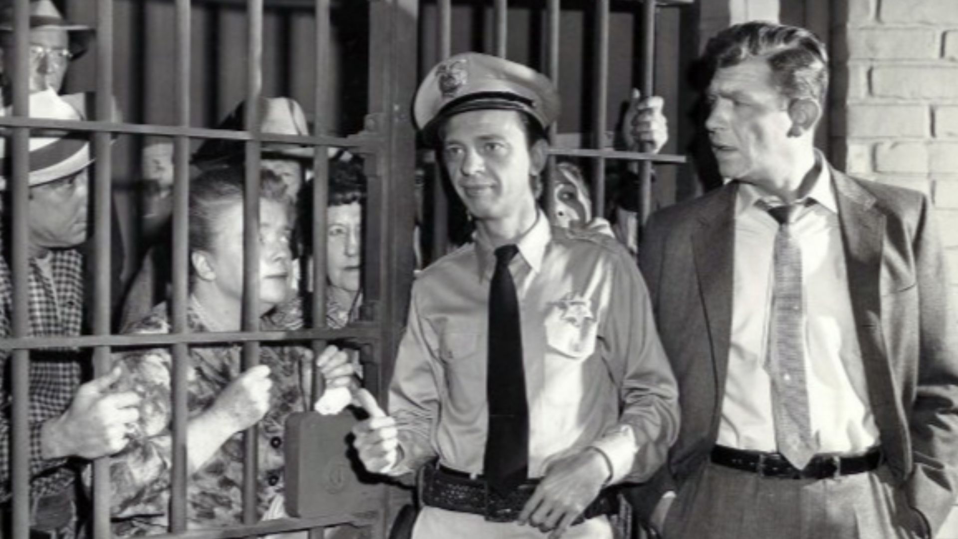 Photo from the television program The Andy Griffith Show.  When Andy returns from a trip, he finds that Barney has managed to put all of Mayberry's citizens behind bars in the town jail.