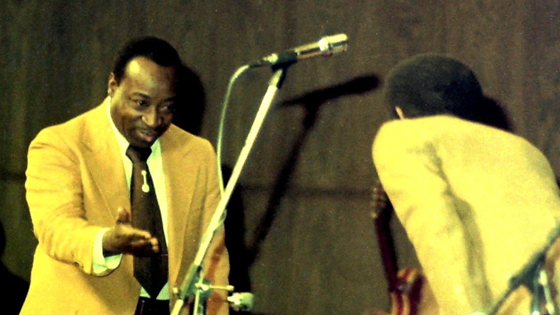 1977 Dave Bartholomew (left, facing front) with Fats Domino (to the right). Rosengarten Mannheim, Germany.