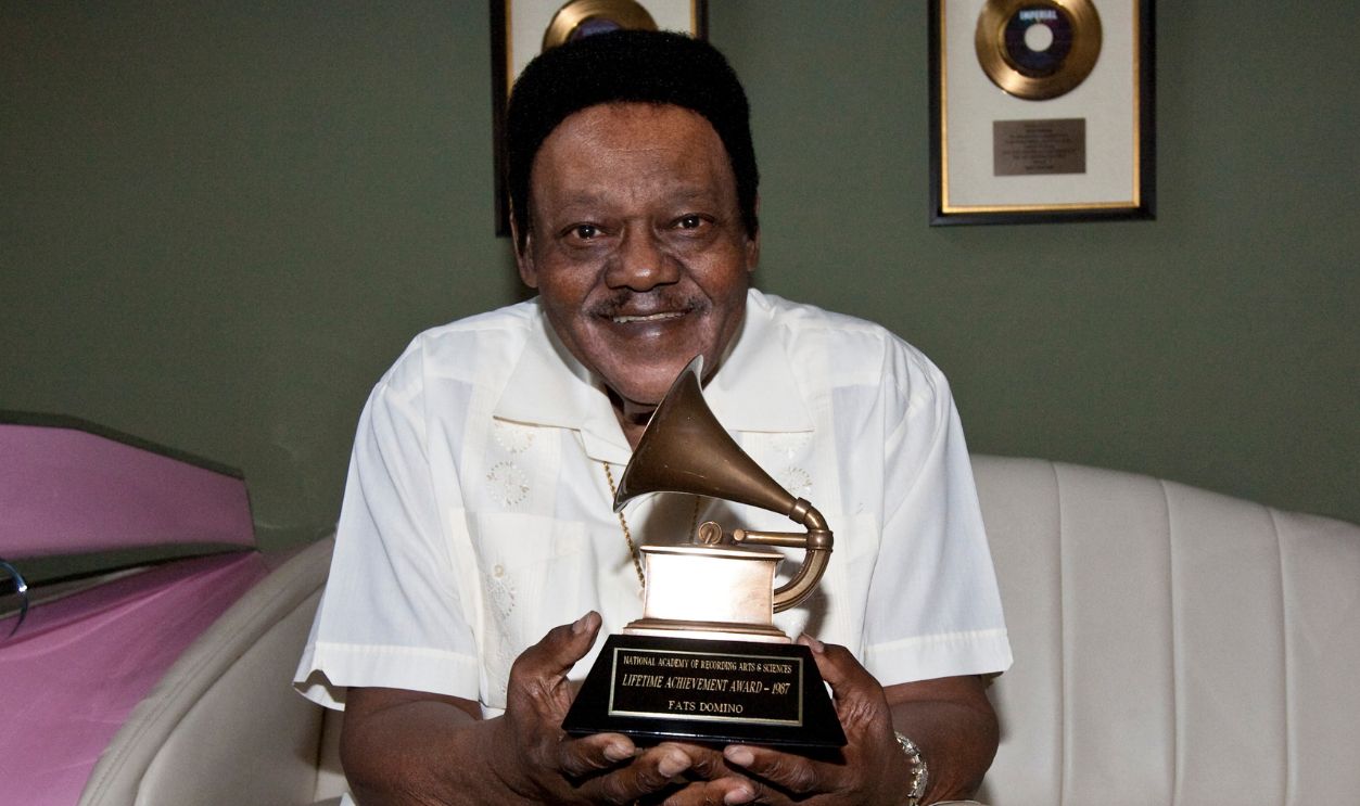 Fats Domino poses after accepting his Grammy Lifetime Achievement Award presented by the Recording Academy's Angelia Bibbs-Sanders at a ceremony to replace Lifetime Achievement Award lost in Hurricane Katrina at Private Residence on May 1, 2009 in New Orleans, Louisiana.