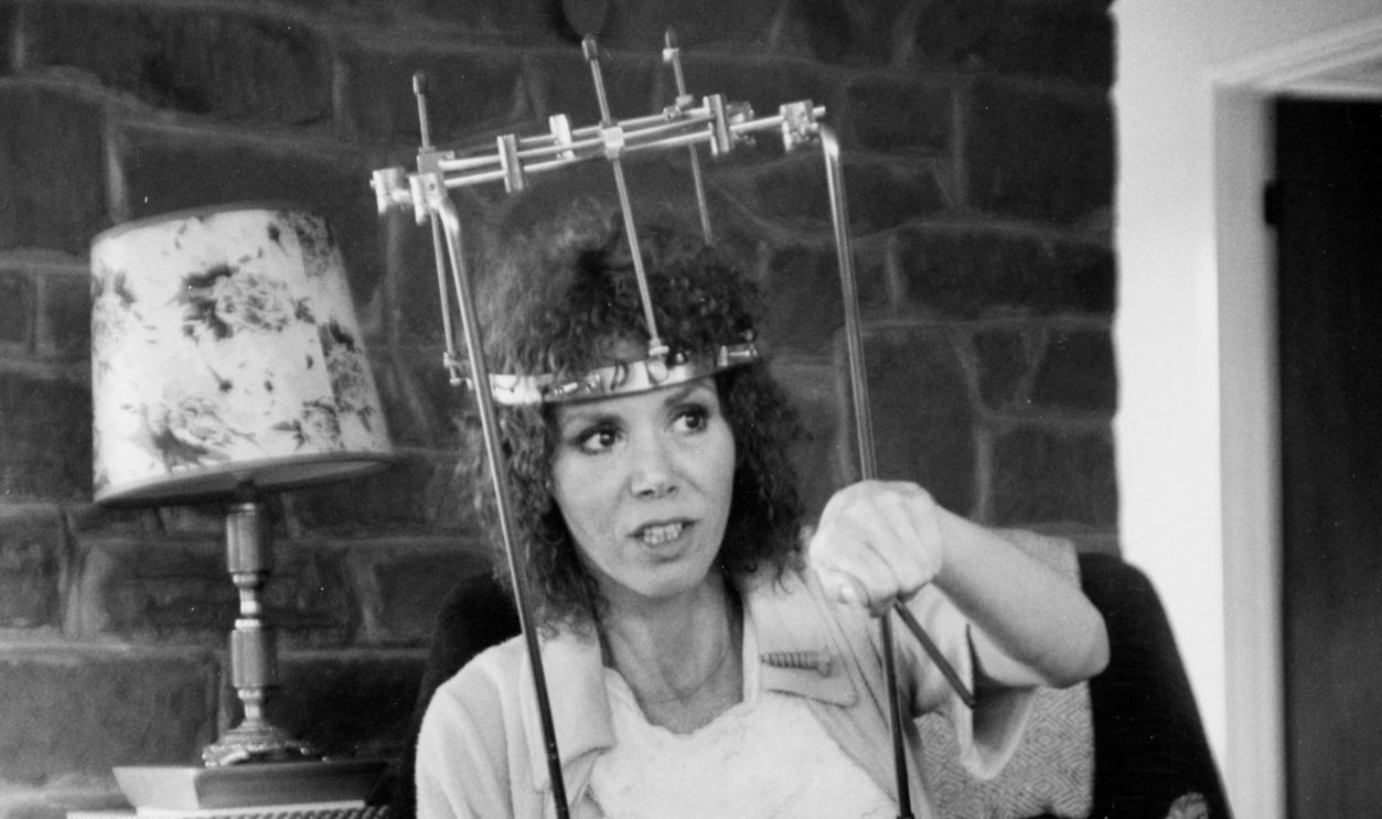 Judy Carne (1939-2015) comedienne and actress, who suffered a broken neck in a car accident, wearing a 'halo brace' at her girlhood home Chapel Brampton, Northhamptonshire, July 24, 1978.