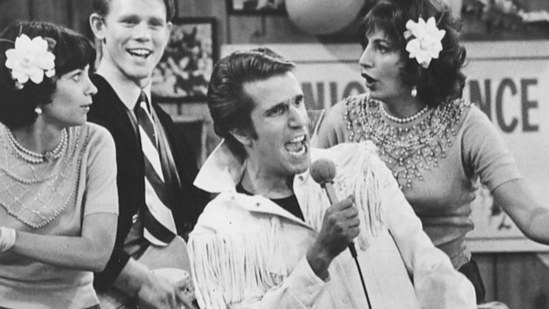 Photo from Happy Days.  In this episode, The Fonz becomes a singing superstar.  Pictured are Cindy Williams as Shirley Feeney, Ron Howard as Richie Cunningham, Henry Winkler as Fonzie and Penny Marshall as Laverne DiFazio.