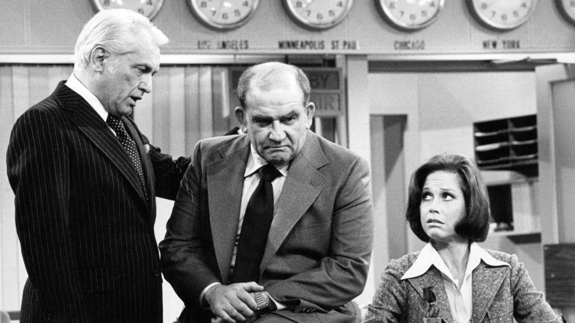 Photo of Ted Knight as Ted Baxter, Ed Asner as Lou Grant and Mary Tyler Moore as Mary Richards from the last episode of The Mary Tyler Moore Show-