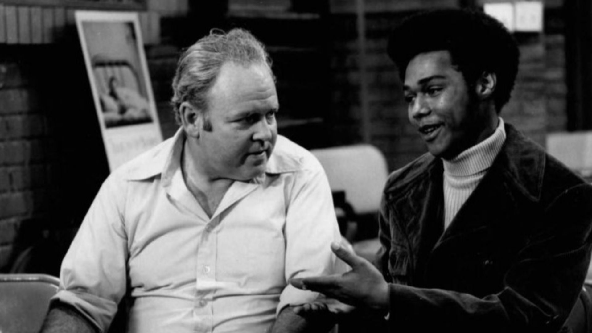 Publicity photo from the television program All in the Family.  Pictured are Carroll O'Connor (Archie Bunker) and Michael Evans (Lionel Jefferson).  In this episode, Archie visits a local blood bank to donate and meets his neighbor, Lionel Jefferson, who 