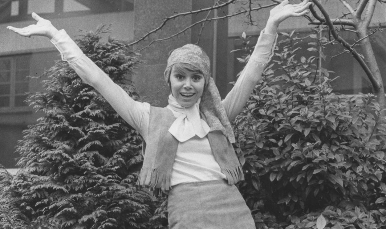 Actress Judy Carne wearing a leather, fringed mini outfit as she poses outside ATV Studios during rehearsals for her show 'Sock it to Me', London, March 4th 1969.