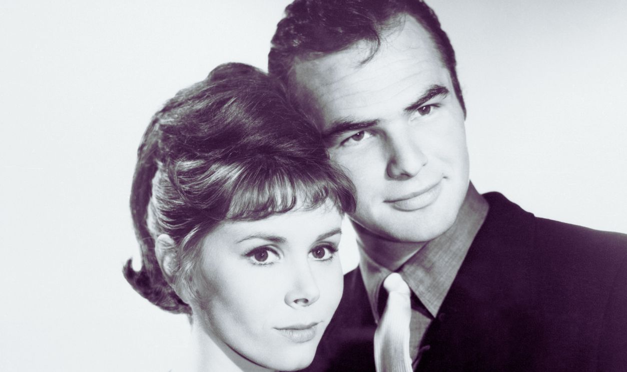Actor Burt Reynolds poses with actress and wife Judy Carne.