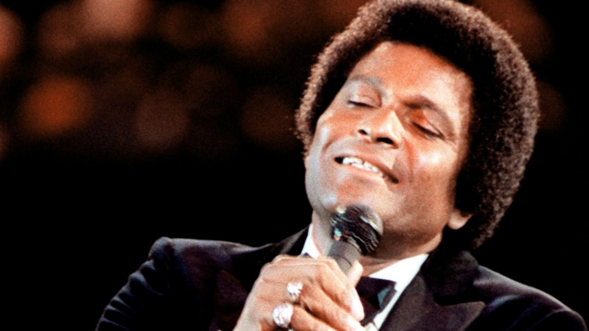 The popular country/western singer Charlie Pride sings to the honored guests during the gala celebration at the Capital Center, on Inauguration Day. (Released to Public)