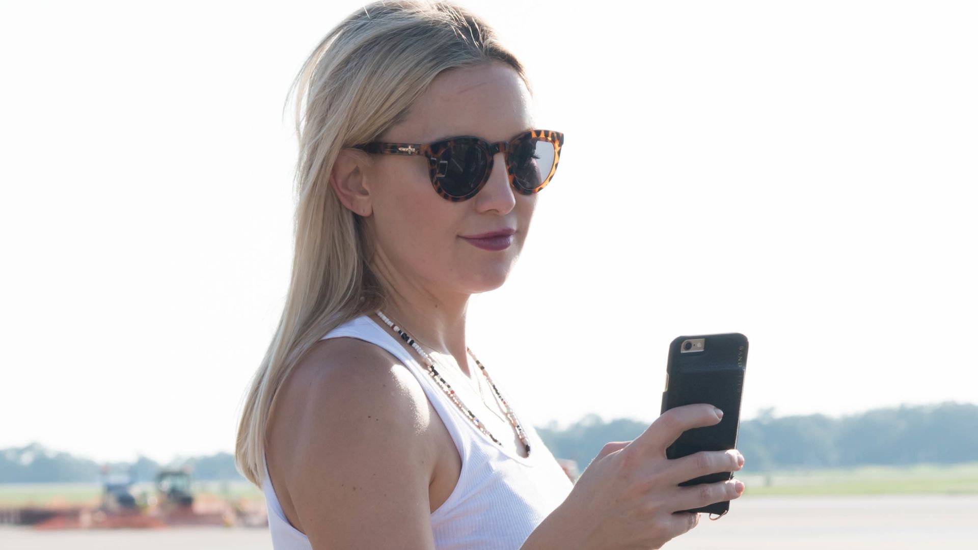 Actress Kate Hudson takes a photo of a WC-130J during her visit to Keesler Air Force Base Sept. 10. She, along with actor Kurt Russell and director Peter Berg toured the base as part of a prescreening of their new film, Deepwater Horizon.