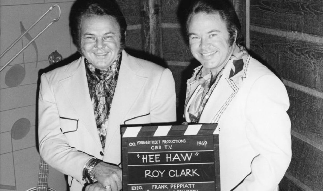 Country musician Roy Clark (right) poses for a portrait with a wax figure of himself at 