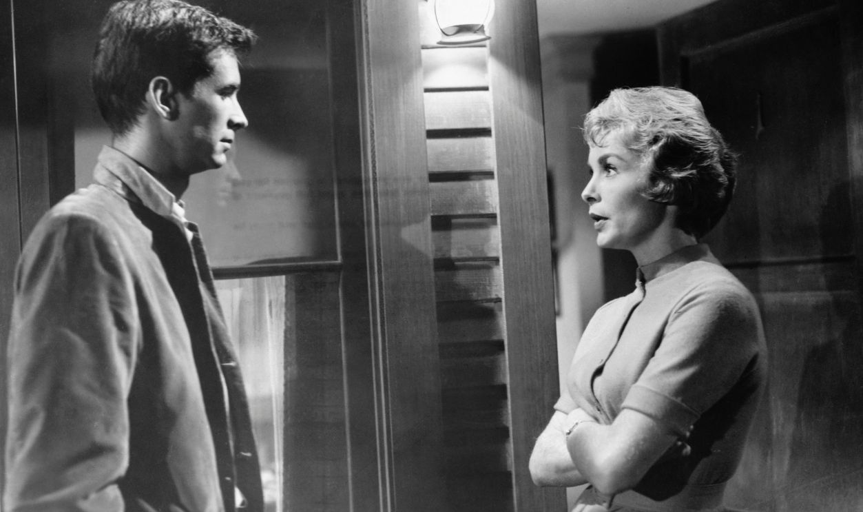Norman Bates (Anthony Perkins) speaks with Bates Motel guest Marion Crane (Janet Leigh) outside her room in a scene from the classic 1960 Alfred Hitchcock thriller, Psycho.