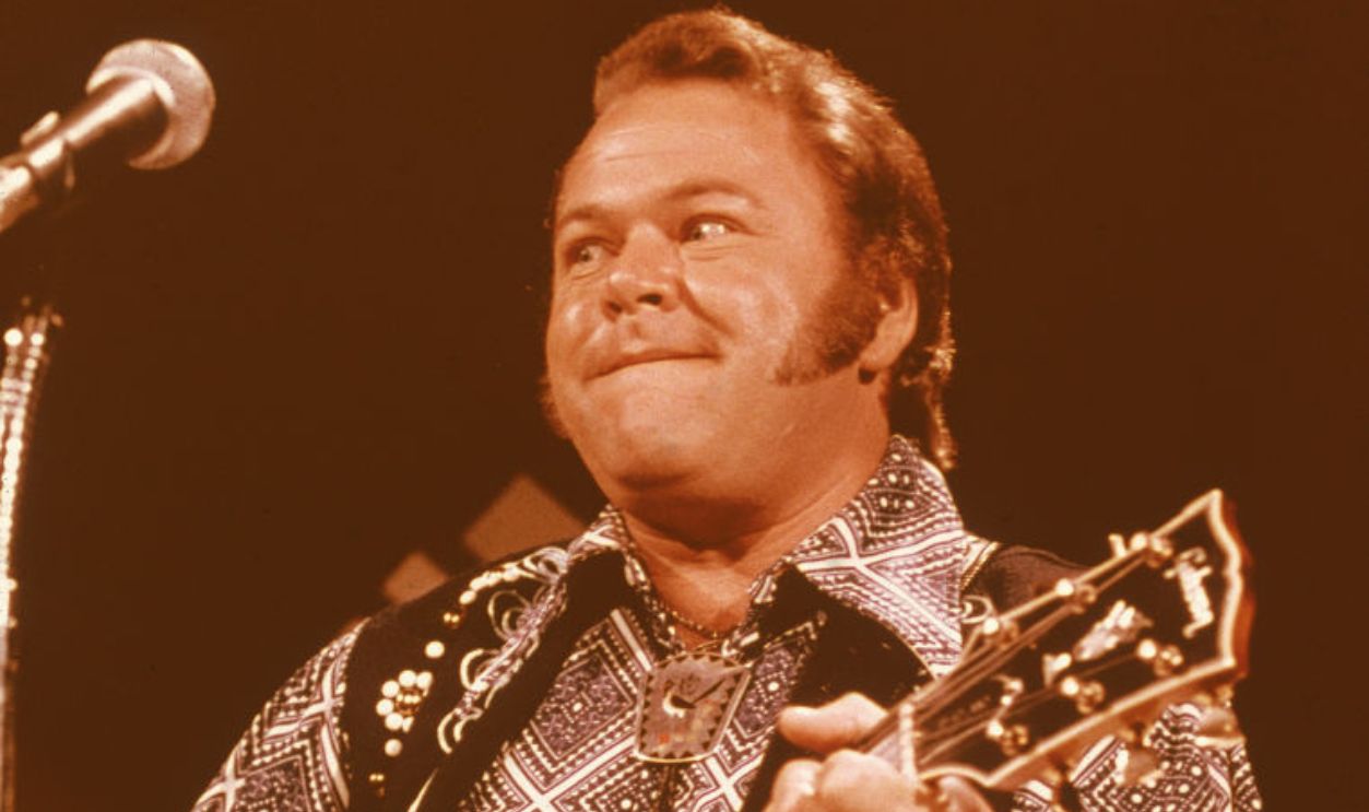American country music singer and guitarist Roy Clark plays his guitar on an episode of the television show 'Midnight Special,' April 1979.