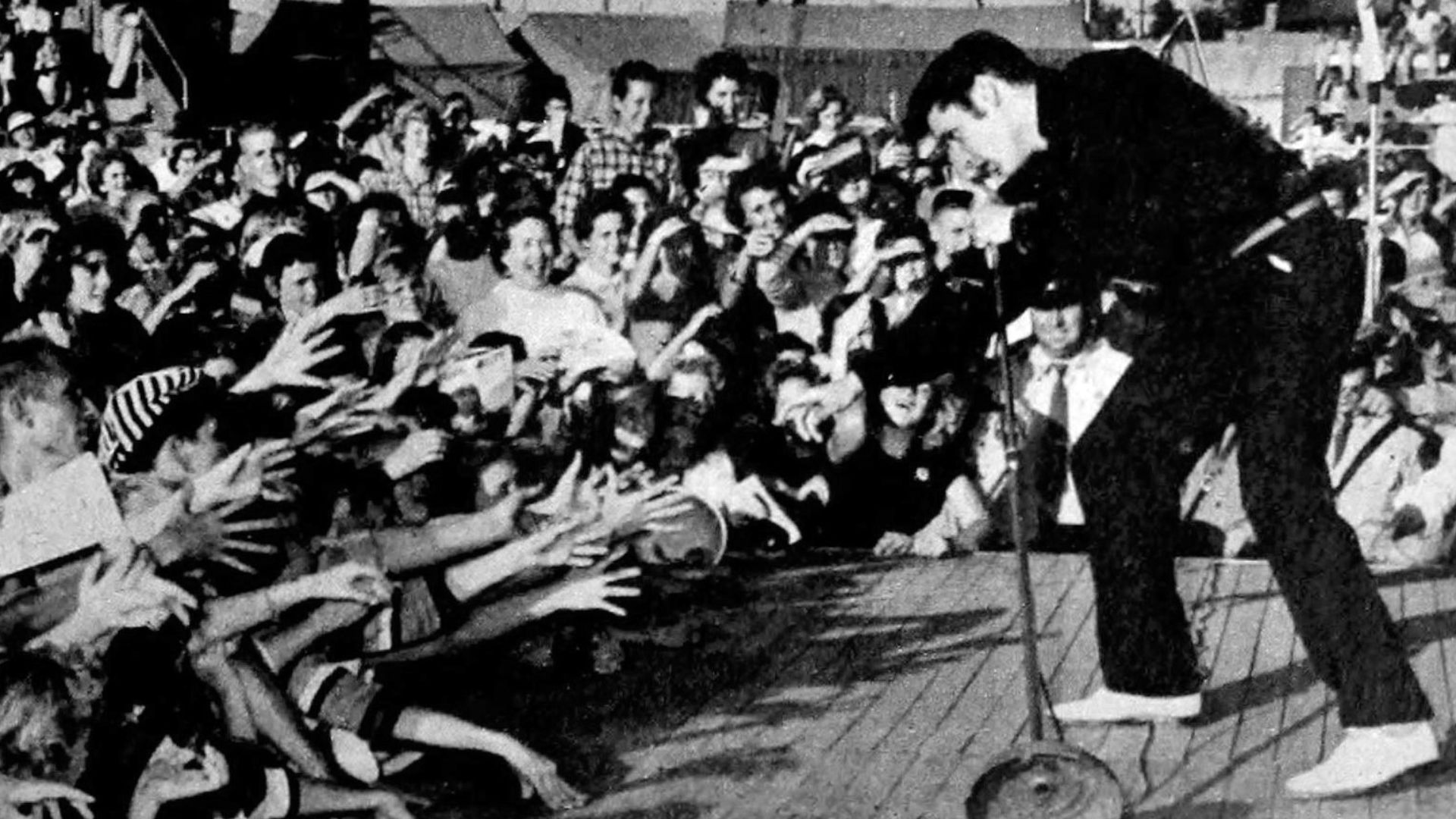Elvis performing live at the Mississippi-Alabama Fairgrounds in Tupelo, Mississippi, September 26, 1956