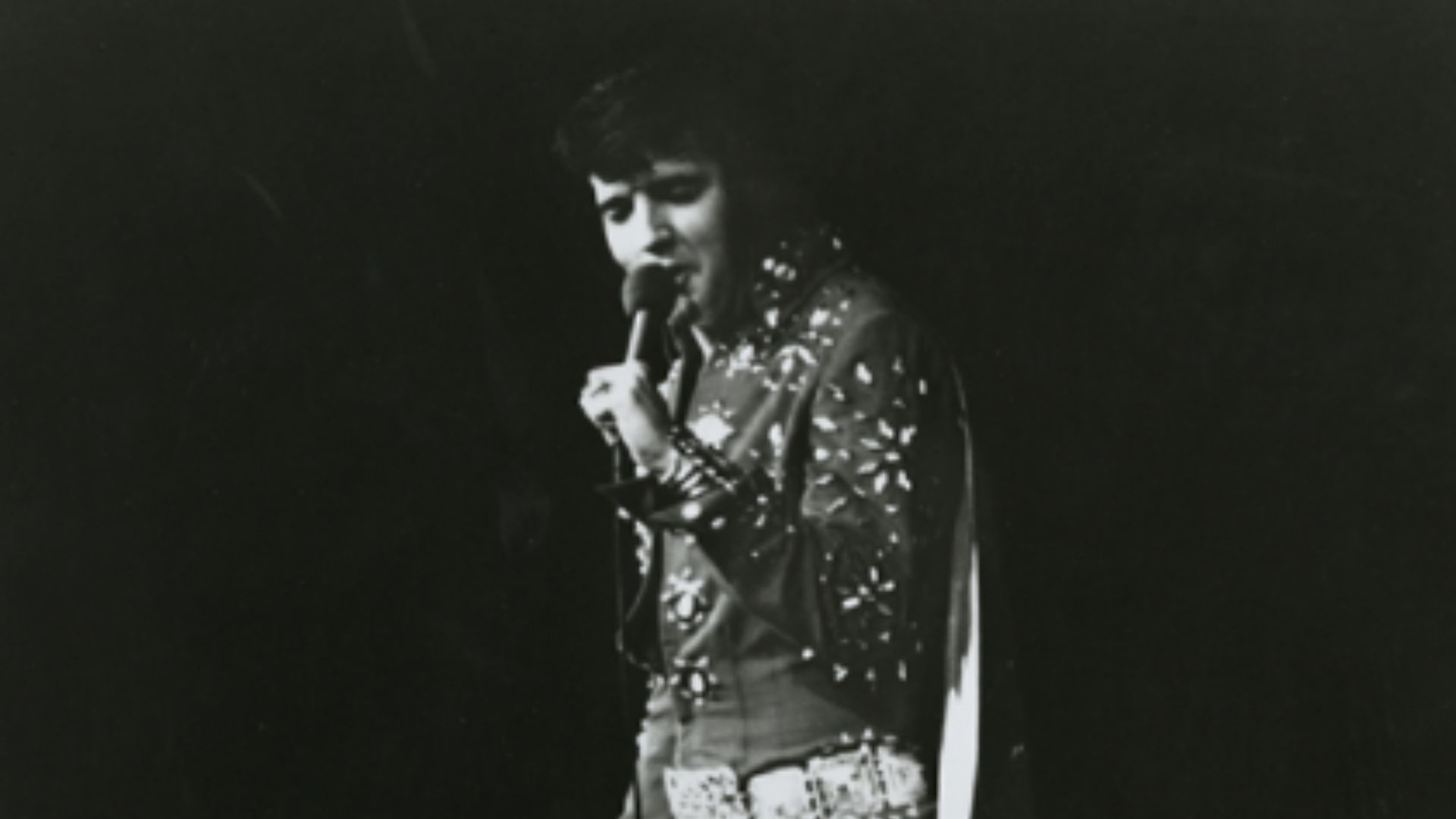 Elvis Presley in concert in 1972, wearing his