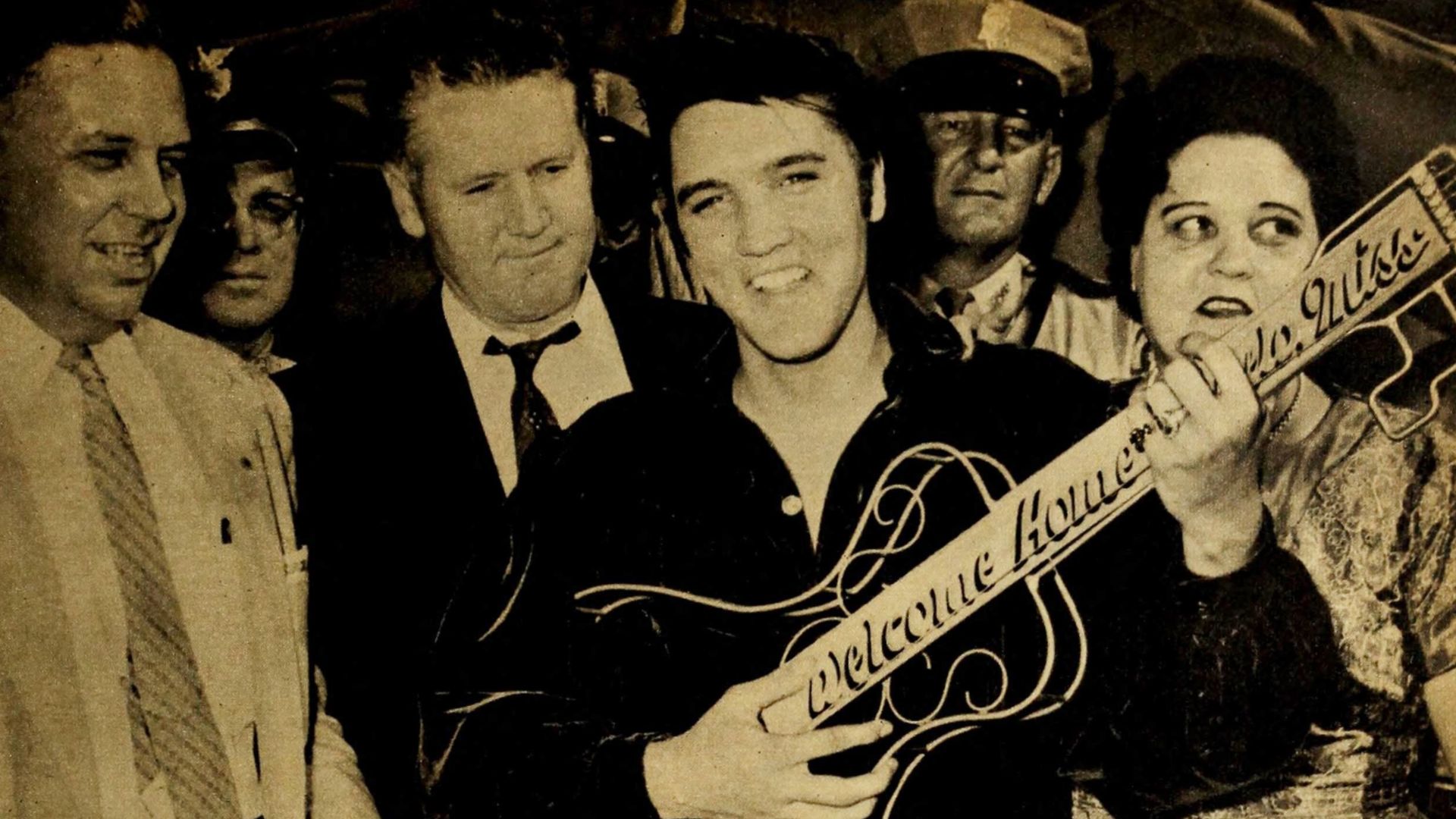 Elvis was given a guitar-shaped key to the city by Mayor James L. Ballard when he returned to Tupelo, Mississippi.