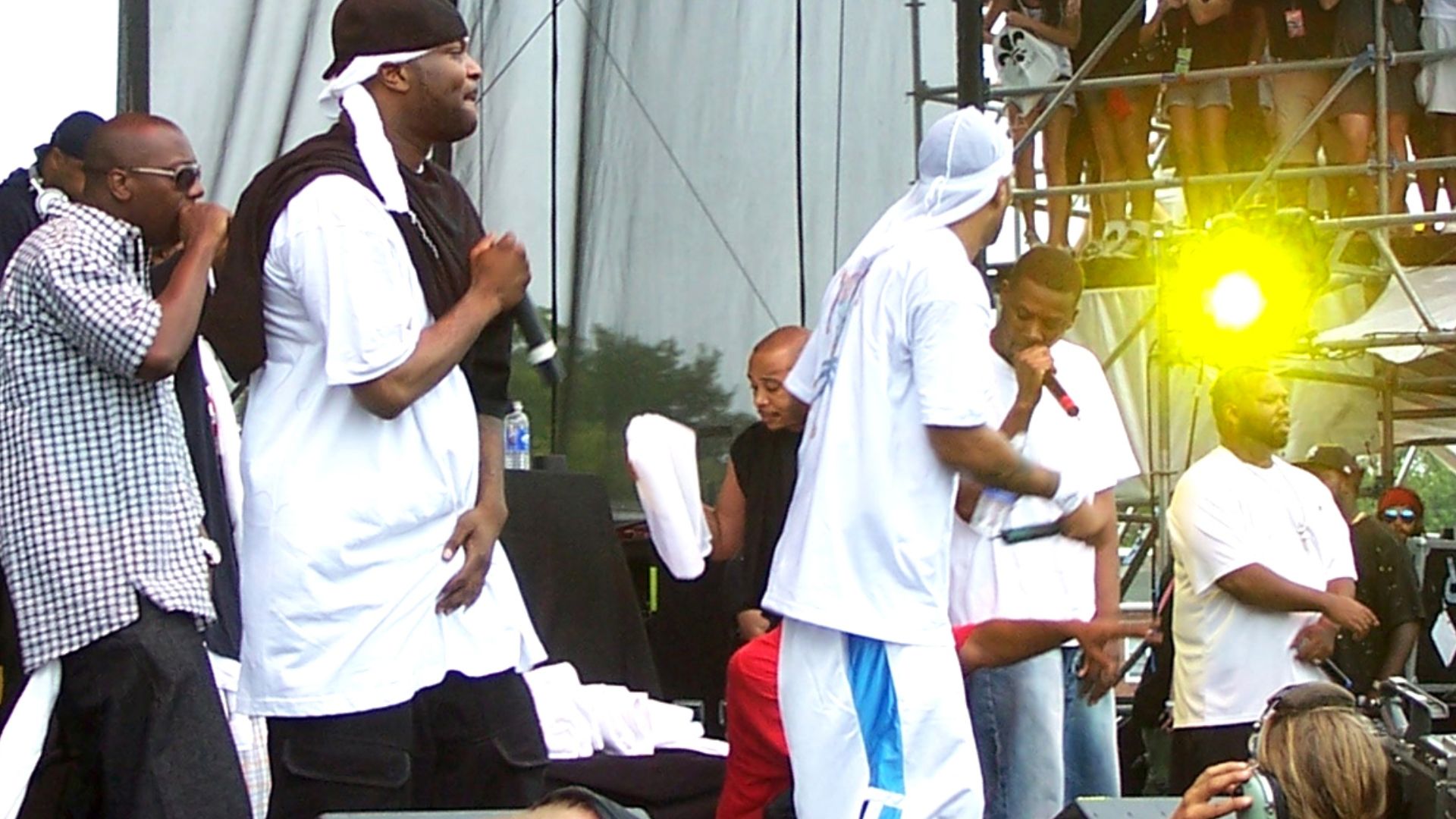 Left to right: Mathematics (in back), Inspecta Deck, Street Life, U-God, Cappadonna (crouched, in red), Method Man, GZA, Raekwon, RZA