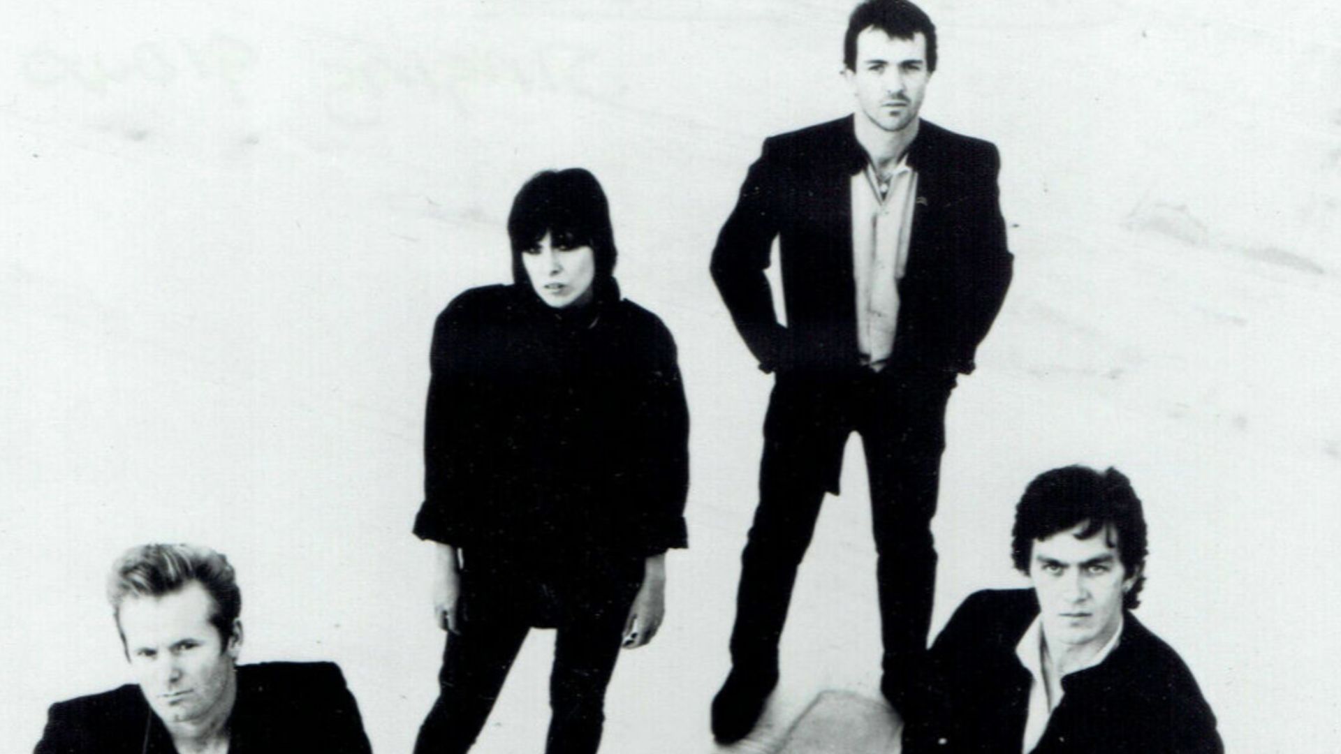Musical group The Pretenders in a publicity photo for their album Learning To Crawl. Pictured left to right; Martin Chambers, Chrissie Hynde, Robbie McIntosh, and Malcolm Foster.