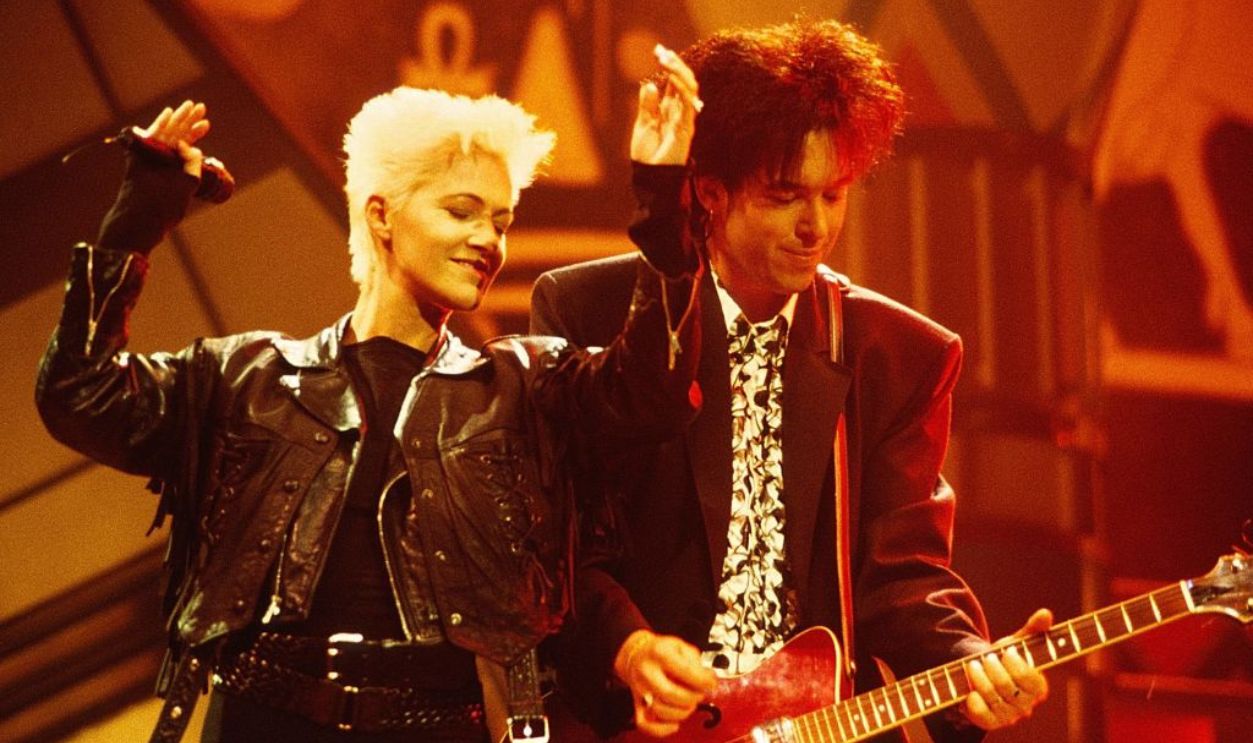 L-R: Marie Fredriksson and Per Gessle of Roxette perform on stage at the Smash Hits Poll Winners Party, Docklands Arena, London, 11th November 1990.