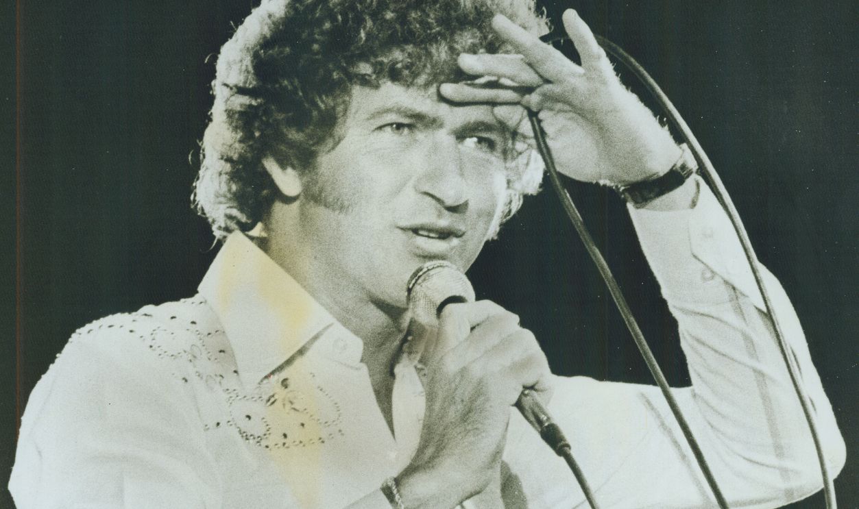 Gettyimages - 502238559, Texas singer Mac Davis. He saved Grandstand show last night 