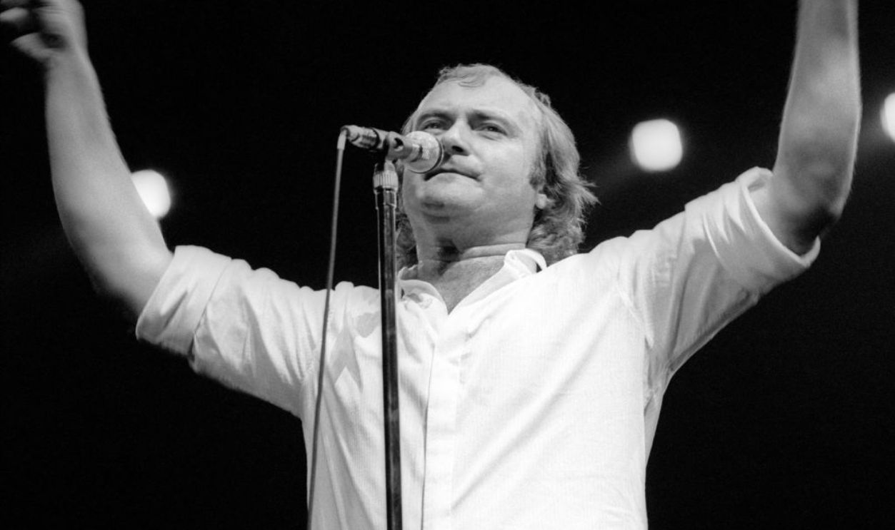 LOS ANGELES, CA - CIRCA 1990: English drummer, singer, record producer, songwriter, and actor Phil Collins, of the English rock band Genesis, sings on stage during a concert circa 1990 in Los Angeles, California. 