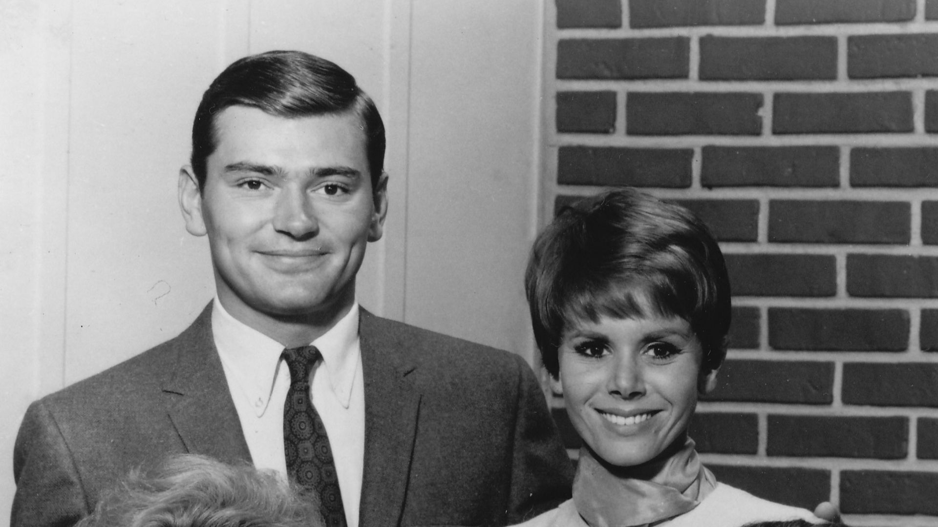 Publicity photo of the cast of the ABC television series Love on a Rooftop; (Top, L–R) Peter Deuel, Judy Carne, (Front, L–R) Edith Atwater, Herbert Voland.