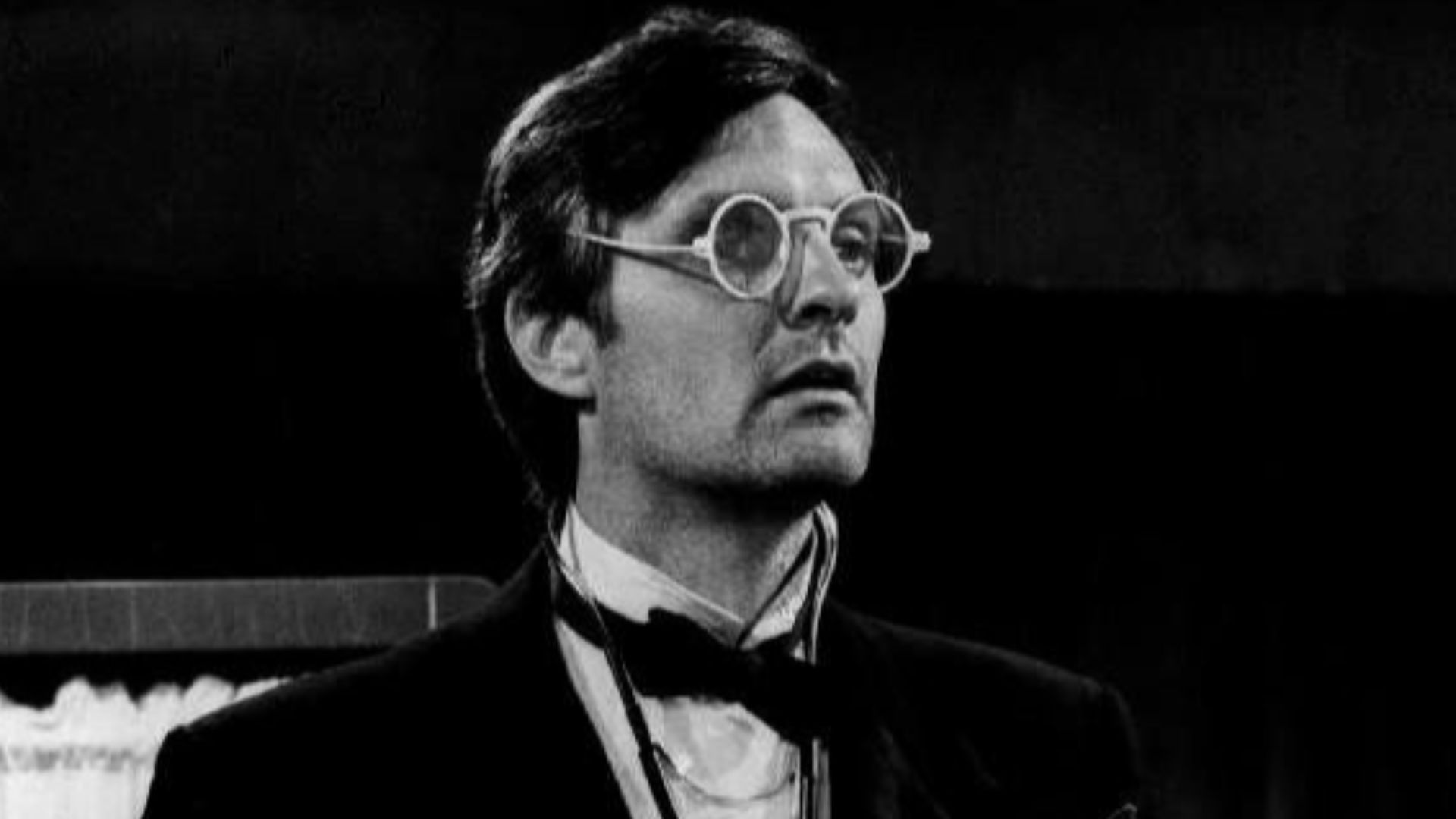 Photo of Alan Alda as Hawkeye from the television program M.A.S.H..  Hawkeye dons black tie for his post-op rounds.
