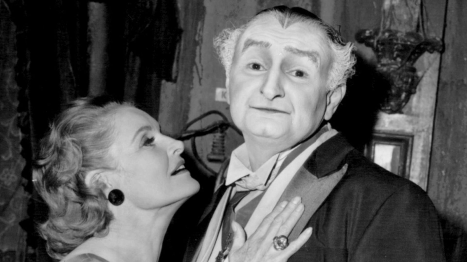Photo of Al Lewis and Linda Watkins from the television series The Munsters.  Grandpa (Lewis) is lonely so he contacts a matchmaking club.