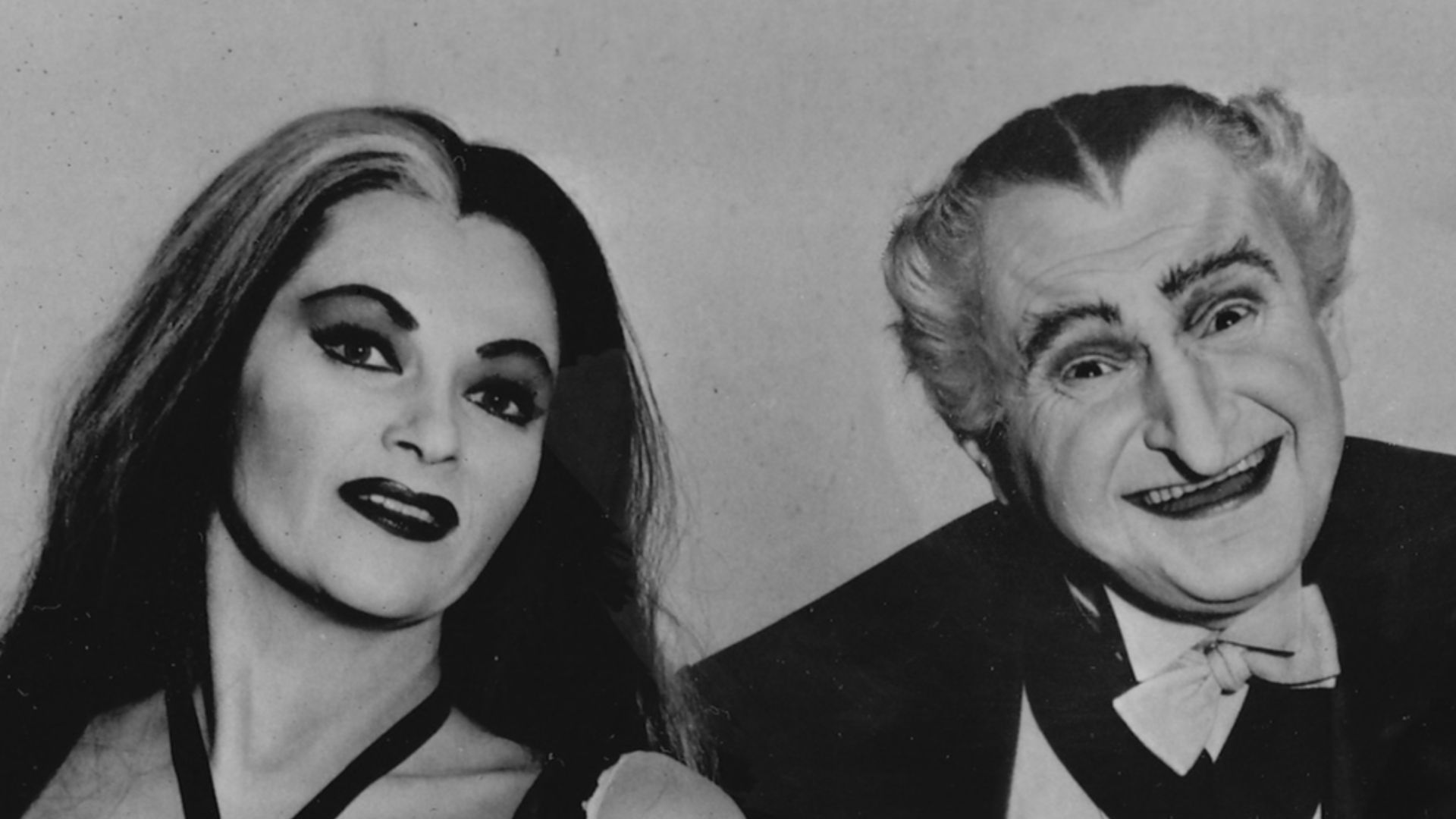 Publicity photo of television actors, (sitting; L–R) Butch Patrick, Fred Gwynne, Beverley Owen, (standing; L–R) Yvonne De Carlo and Al Lewis promoting their roles on the CBS comedy series The Munsters.