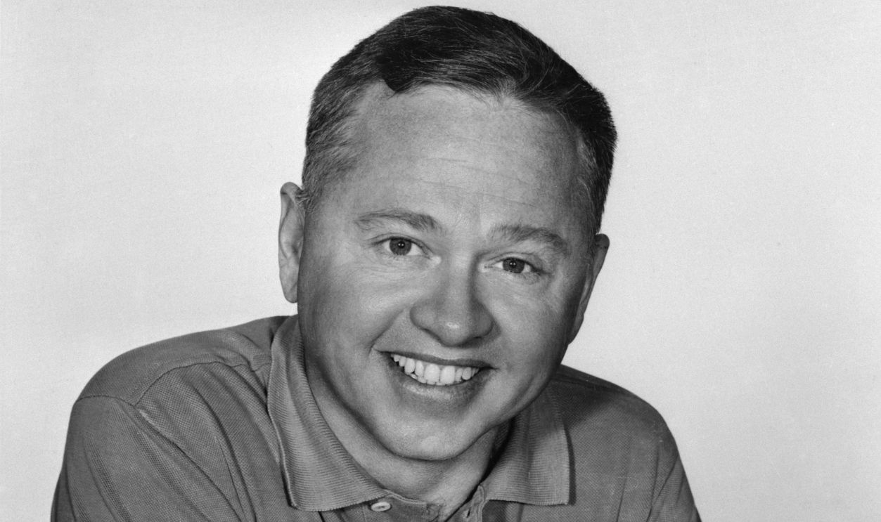 Veteran actor Mickey Rooney is shown smiling in this closeup shot.