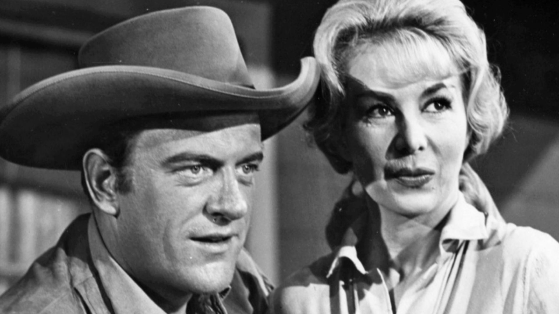Photo of James Arness as Matt Dillon and guest star Susan Cummings in Gunsmoke.