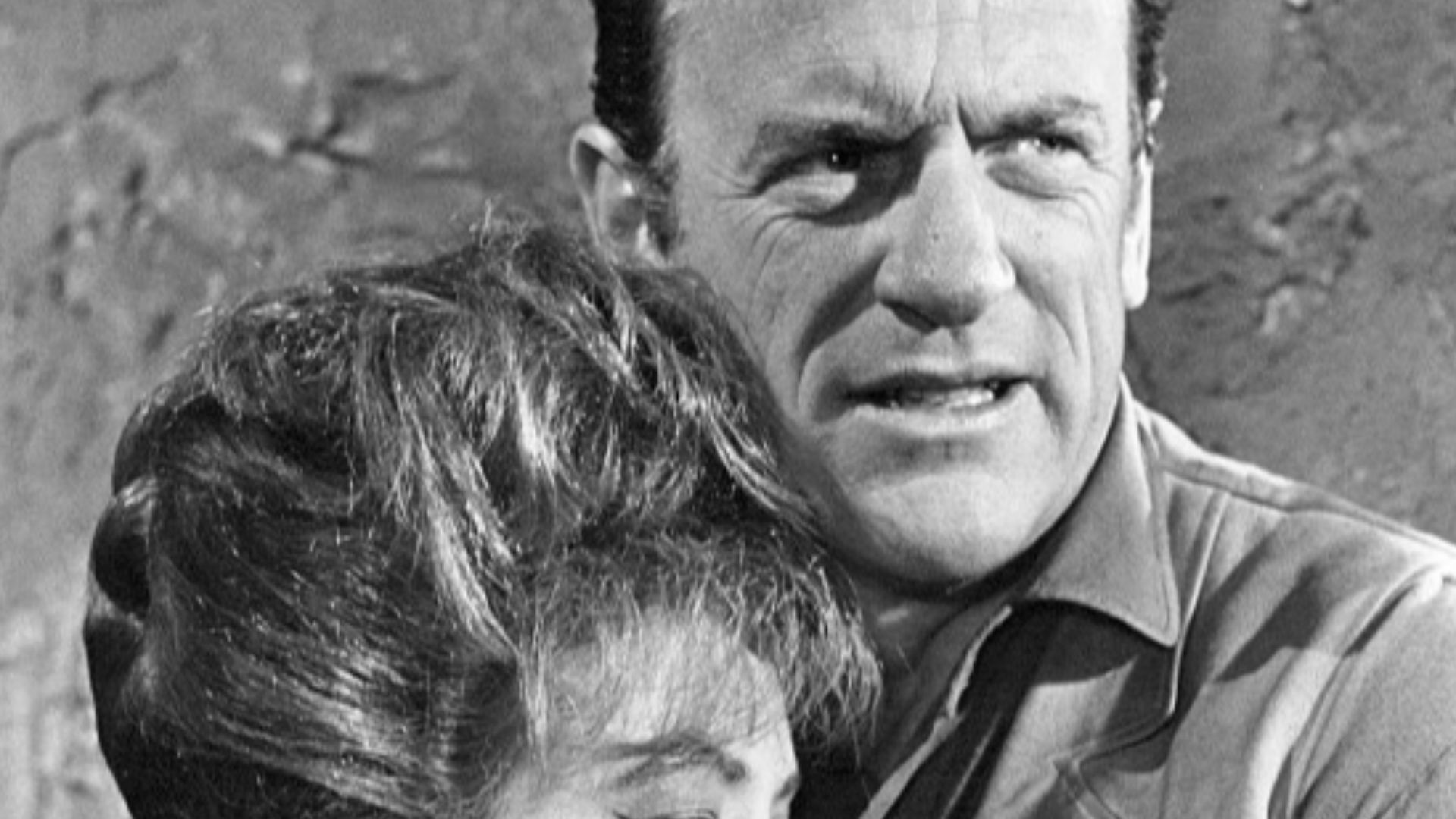 Photo of Amanda Blake as Miss Kitty Russell and James Arness as Marshall Matt Dillon from Gunsmoke.