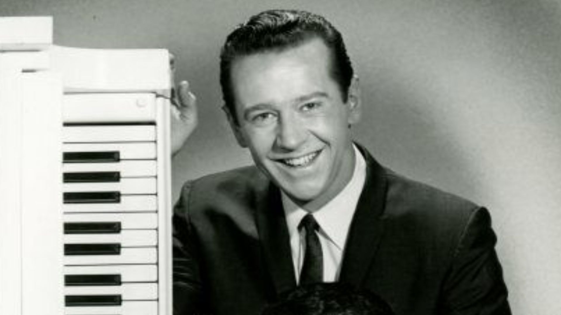 Press photo of (from top) George Carlin and Buddy Greco for the CBS television program Away We Go (1967)