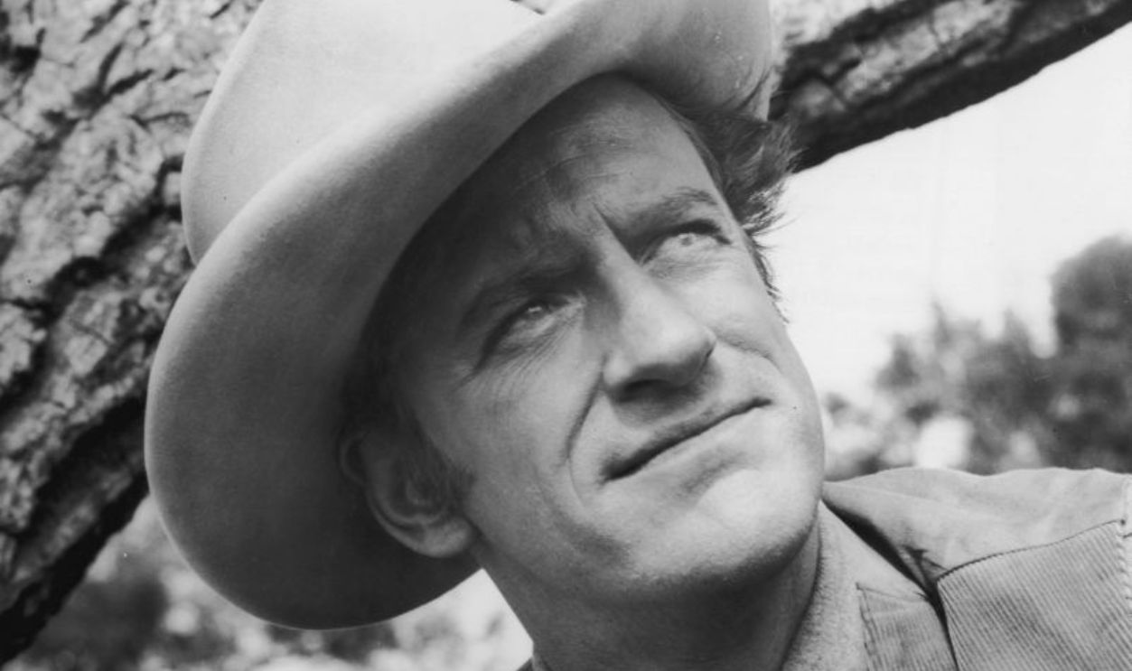 1955: American actor James Arness wears a cowboy hat as Marshal Matt Dillon in a promotional portrait on the television show 'Gunsmoke'. 