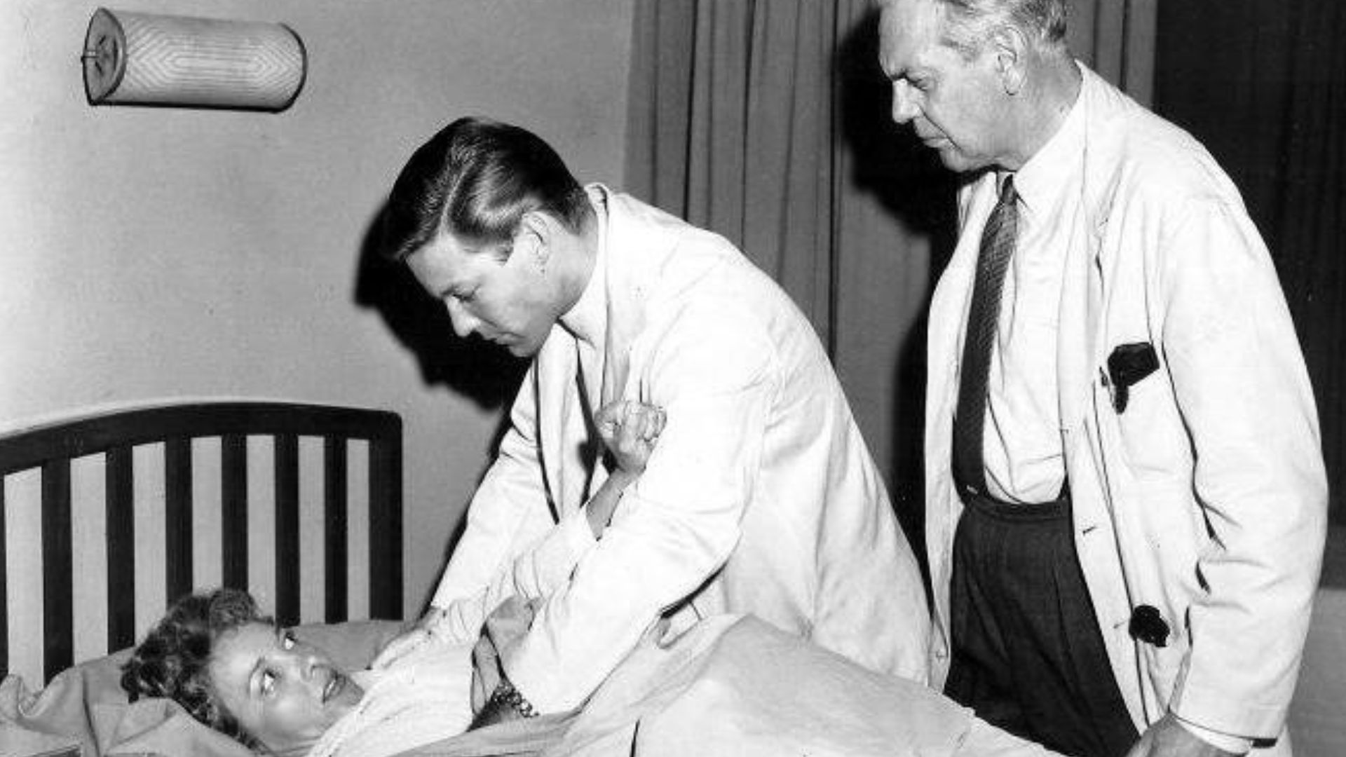 Photo from the first episode of the television program Dr. Kildare.  Beverly Garland is the patient Kildare (Richard Chamberlain) is having difficulty with while Dr. Gillespie (Raymond Massey) tries to help.
