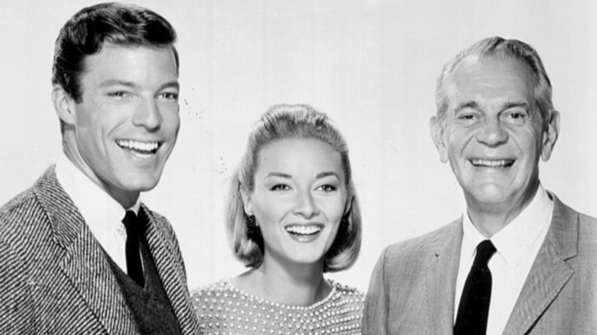 Photo of Richard Chamberlain (Dr. Kildare), Daniela Bianchi and Raymond Massey (Dr. Gillespie) from the television program Dr. Kildare. This episode takes the doctors to Rome for information on a medical breakthrough. There is also time for romance for bo