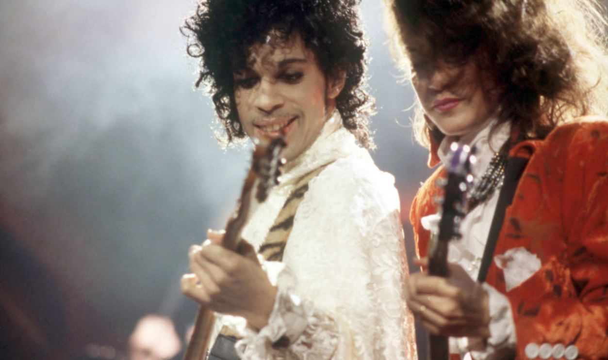 DETROIT, MI - NOVEMBER 4: American singer, songwriter, musician, record producer, dancer, actor, and filmmaker Prince (1958-2016) and American guitarist, singer-songwriter and member of the Revolution Wendy Melvoin perform onstage during the 1984 Purple Rain Tour on November 4, 1984, at the Joe Louis Arena in Detroit, Michigan.