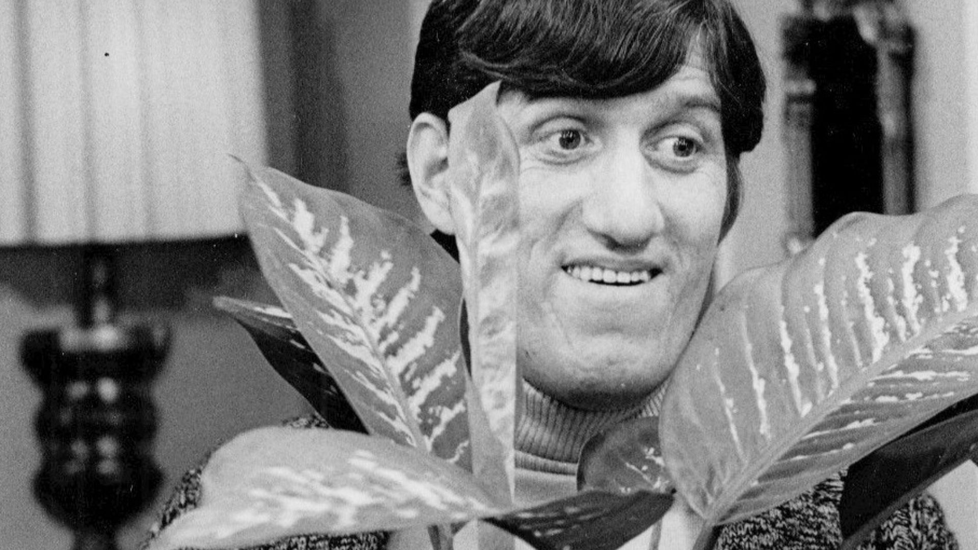 Photo of Paul Benedict as Harry Bentley, neighbor of George and Louise Jefferson.  In this photo from The Jeffersons, Harry asks George and Louise to plant-sit for him.