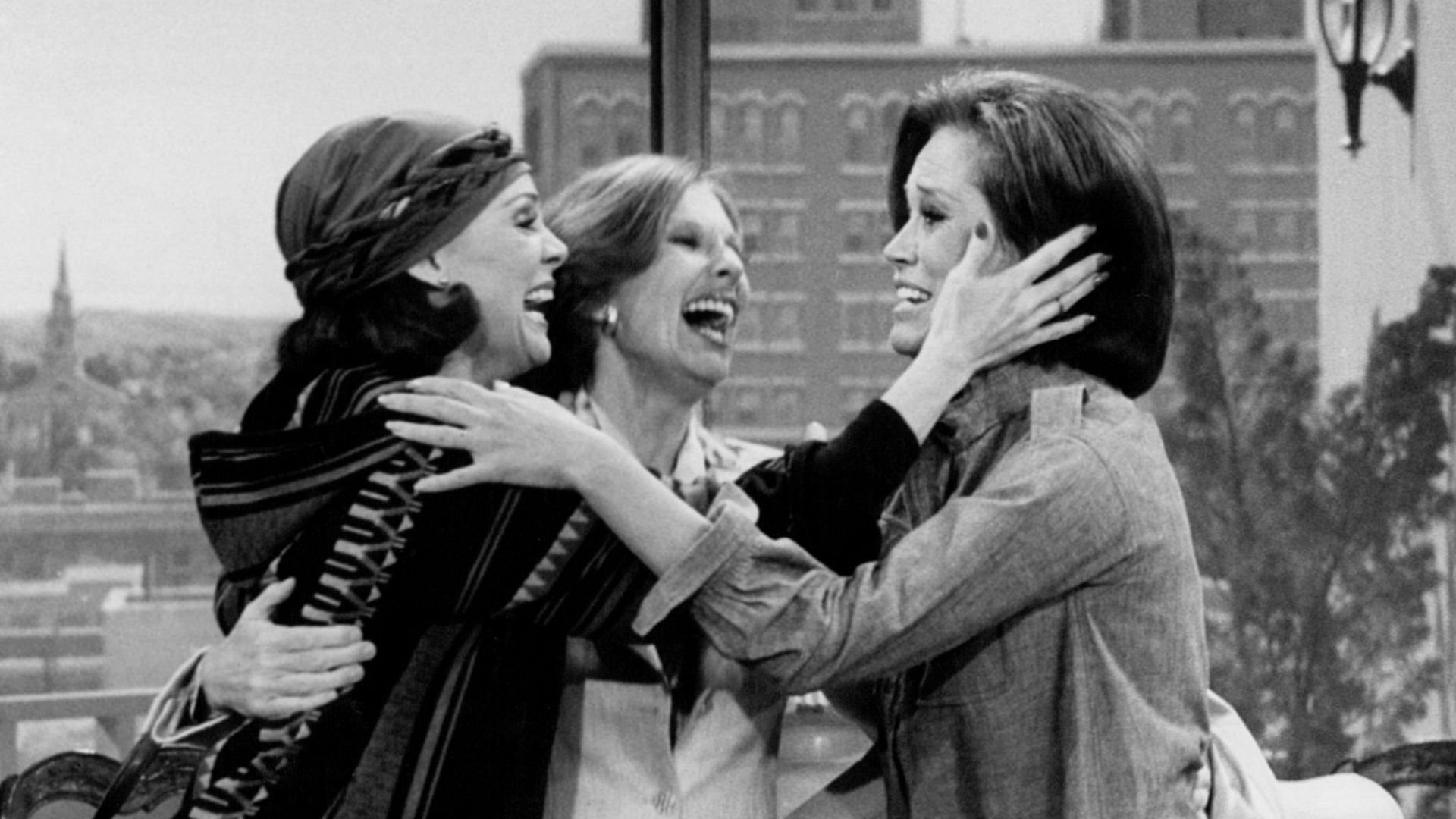 Photo from the last episode of The Mary Tyler Moore Show.  Rhoda Gerard (Valerie Harper, left) and Phyllis Lindstrom (Cloris Leachman, center) come to cheer up Mary Richards (Mary Tyler Moore) after hearing the news that WJM-TV has been sold and that she 
