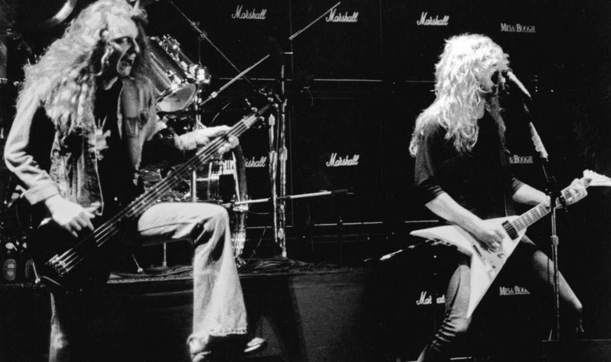 1981: Original bassist Cliff Burton and singer and guitarist James Hetfield of the heavy metal quartet Metallica perform onstage in 1981.