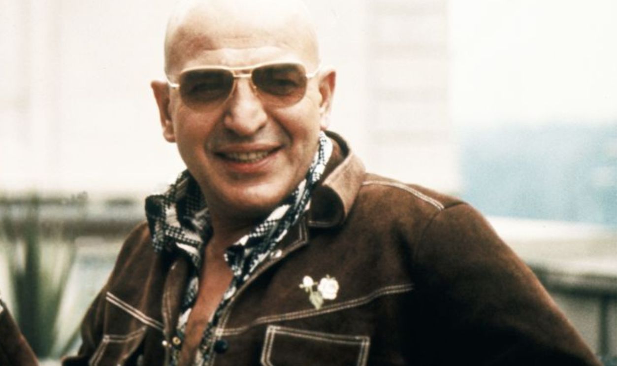 UNSPECIFIED - JANUARY 01: Portrait Of Telly Savalas With Champagne Cocktail