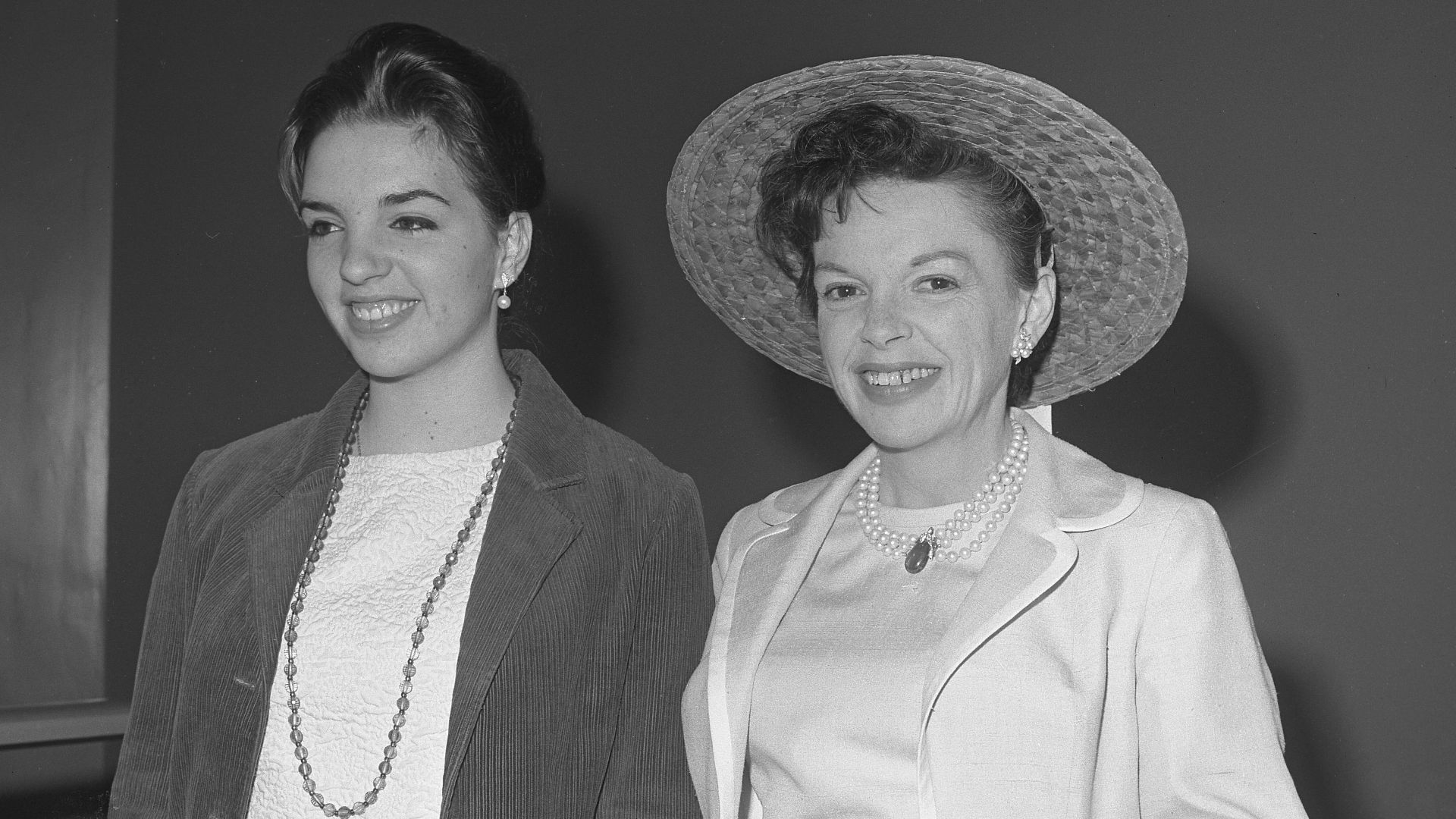 Judy Garland is accompanied by daughter Liza Minnelli, on arrival in Superior Court in Santa Monica where Judy reached a settlement with her estranged husband, Sid Luft, over custody of children, Lorna, 11, and Joseph, 8. Luft will have them for several h