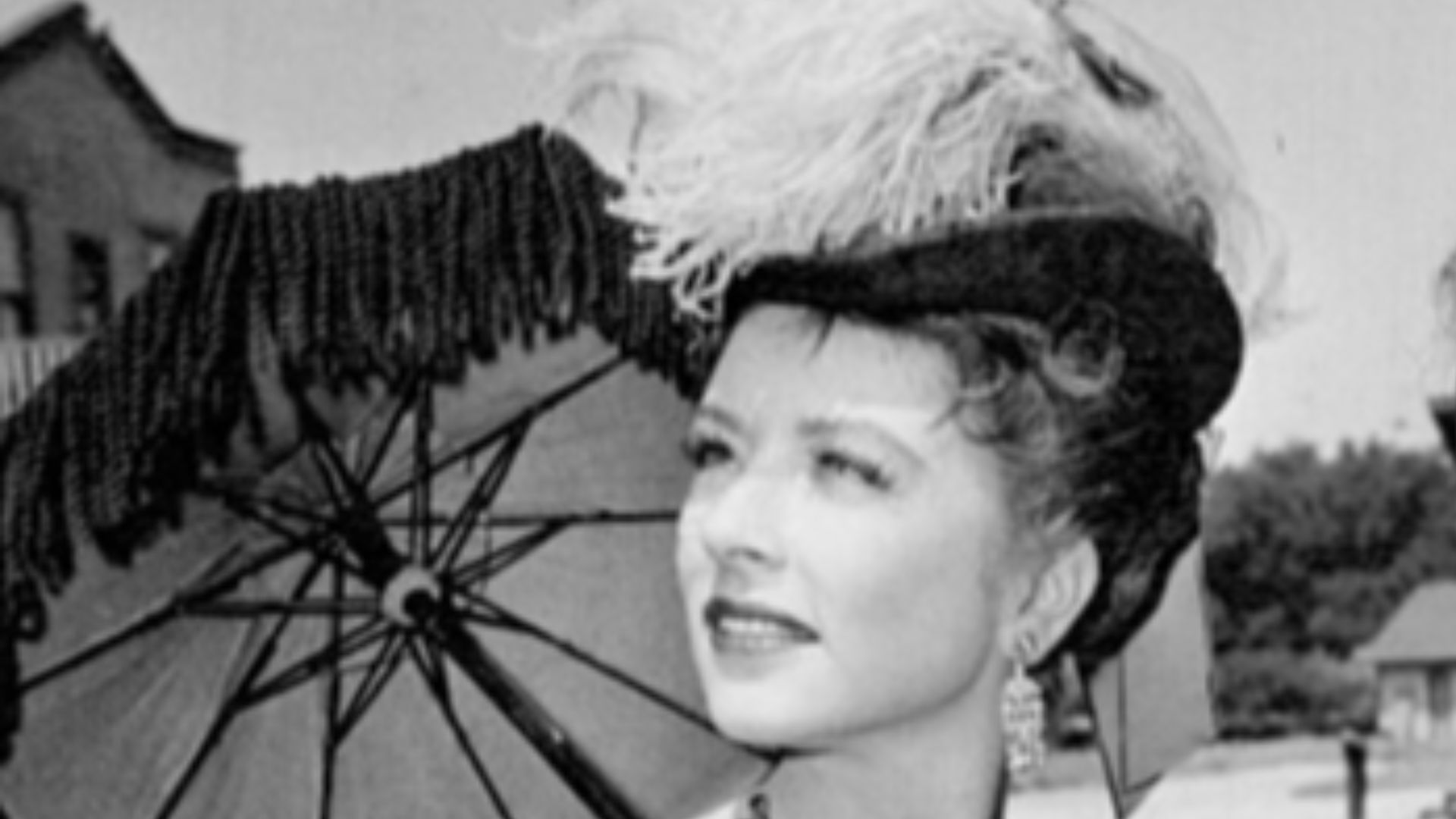 Photo of Amanda Blake as Miss Kitty and Milburn Stone as Doc Adams from Gunsmoke.
