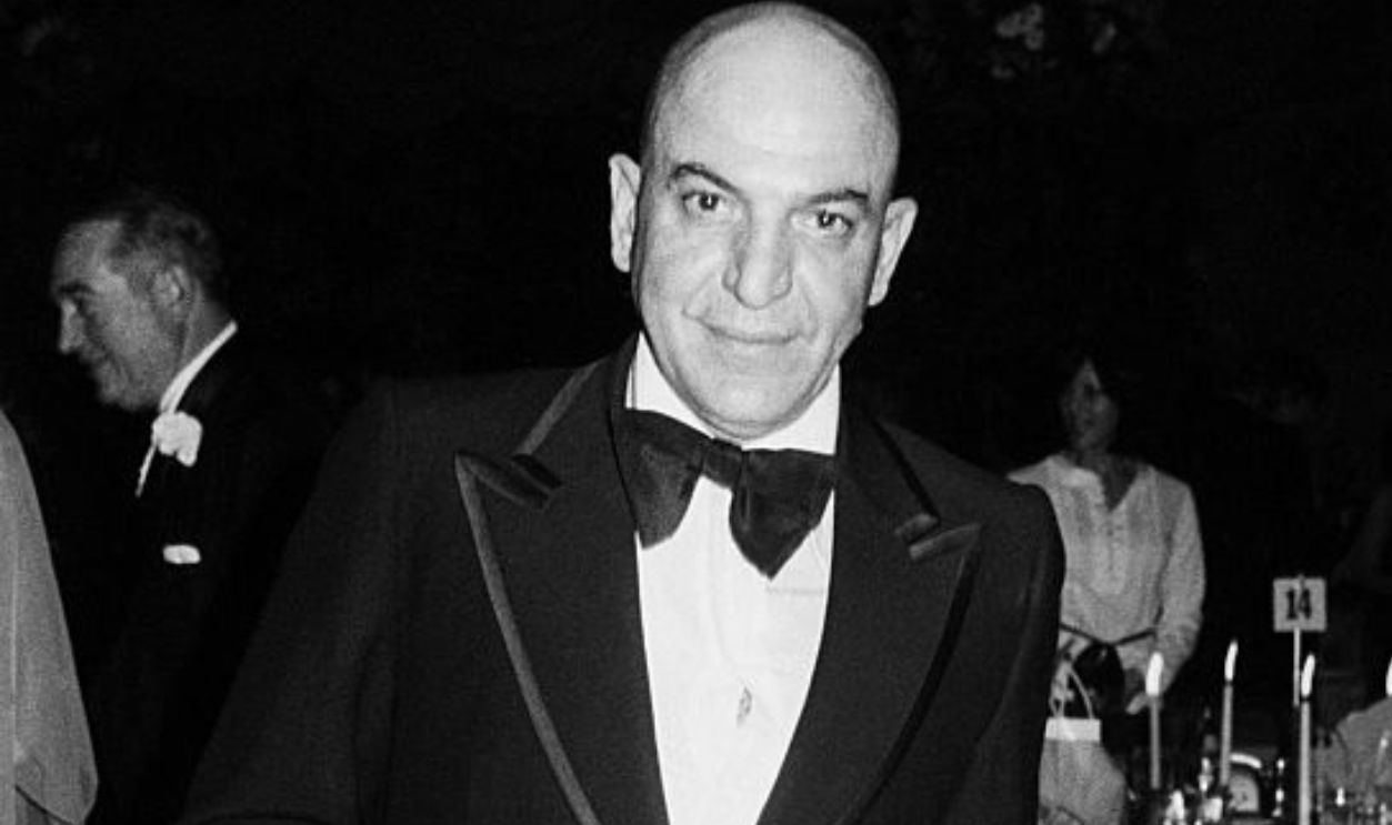 Telly Savalas at formal event in a tuxedo; circa 1970; New York.
